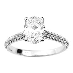 Oval Cut Diamond Solitaire Engagement Ring with Pavé Set Diamond Band