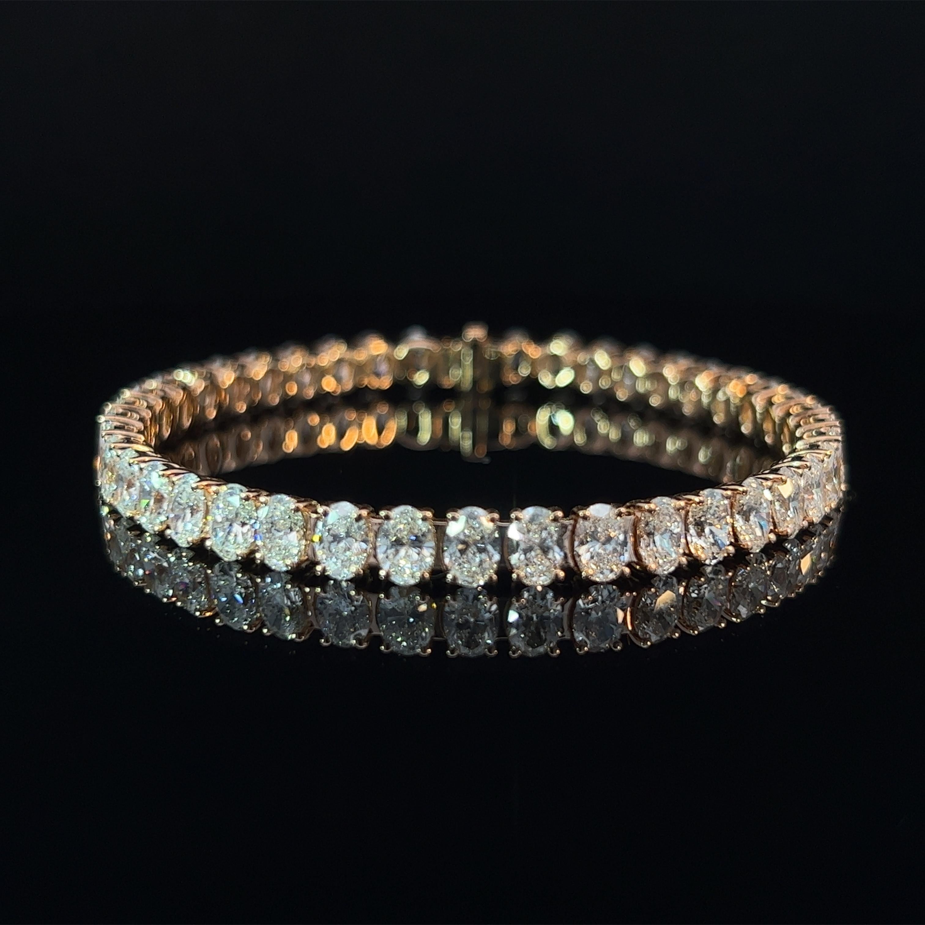 Diamond Shape: Oval Cut 
Total Diamond Weight: 13.2ct
Individual Diamond Weight: .33ct
Color/Clarity: GH VVS  
Metal: 18K Rose Gold  
Metal Weight: 16.46g 

Key Features:

Oval-Cut Diamonds: The centerpiece of this bracelet features a dazzling array