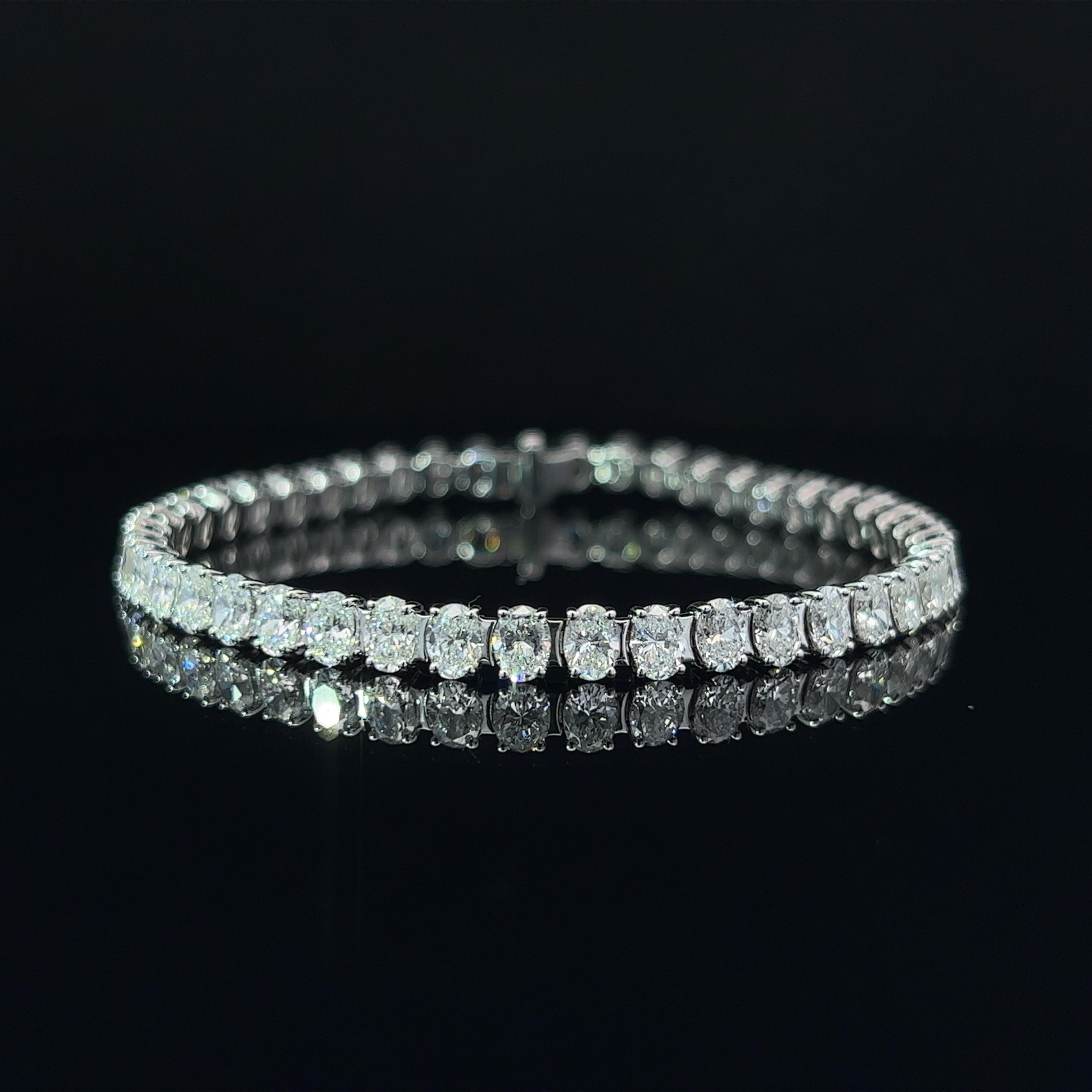 Diamond Shape: Oval Cut 
Total Diamond Weight: 10.59ct
Individual Diamond Weight: .25ct
Color/Clarity: GH VVS  
Metal: 18K White Gold  
Metal Weight: 14.18g 

Key Features:

Oval-Cut Diamonds: The centerpiece of this bracelet features a dazzling