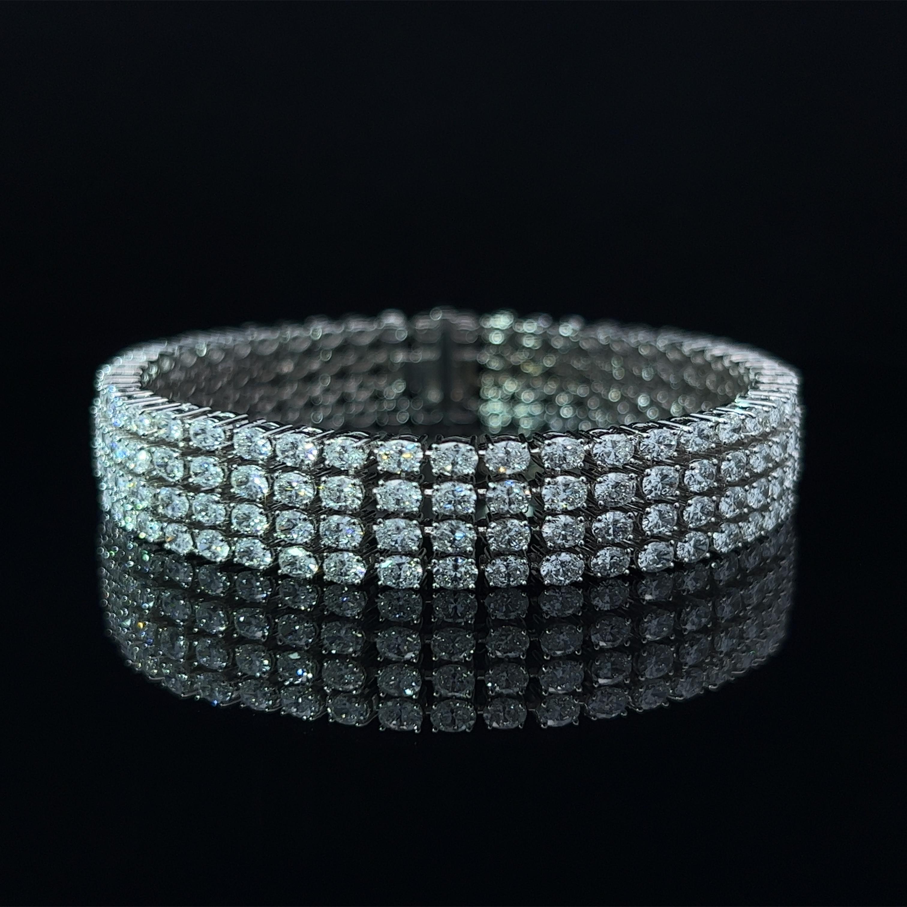Diamond Shape: Oval Cut 
Total Diamond Weight: 15.36ct
Individual Diamond Weight: .10ct
Color/Clarity: EF VVS  
Metal: 18K White Gold  
Metal Weight: 33.6g 

Key Features:

Oval-Cut Diamonds: The centerpiece of this bracelet showcases a dazzling
