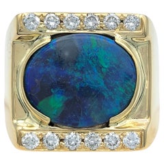 Oval Cut East West Black Opal Cocktail Ring with Diamonds 14 Karat Yellow Gold