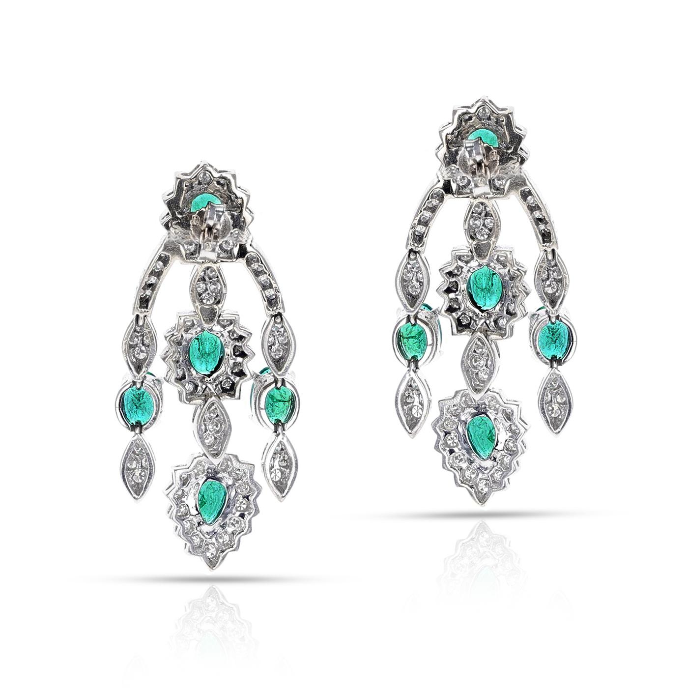 A stunning pair of Oval-Cut Emerald and Diamond Chandelier Dangle Earrings with French Marks. The earrings are made in 14 Karat White Gold. The total weight is 24.37 grams. The length is 1.85 inches and the width is 0.78 inches.