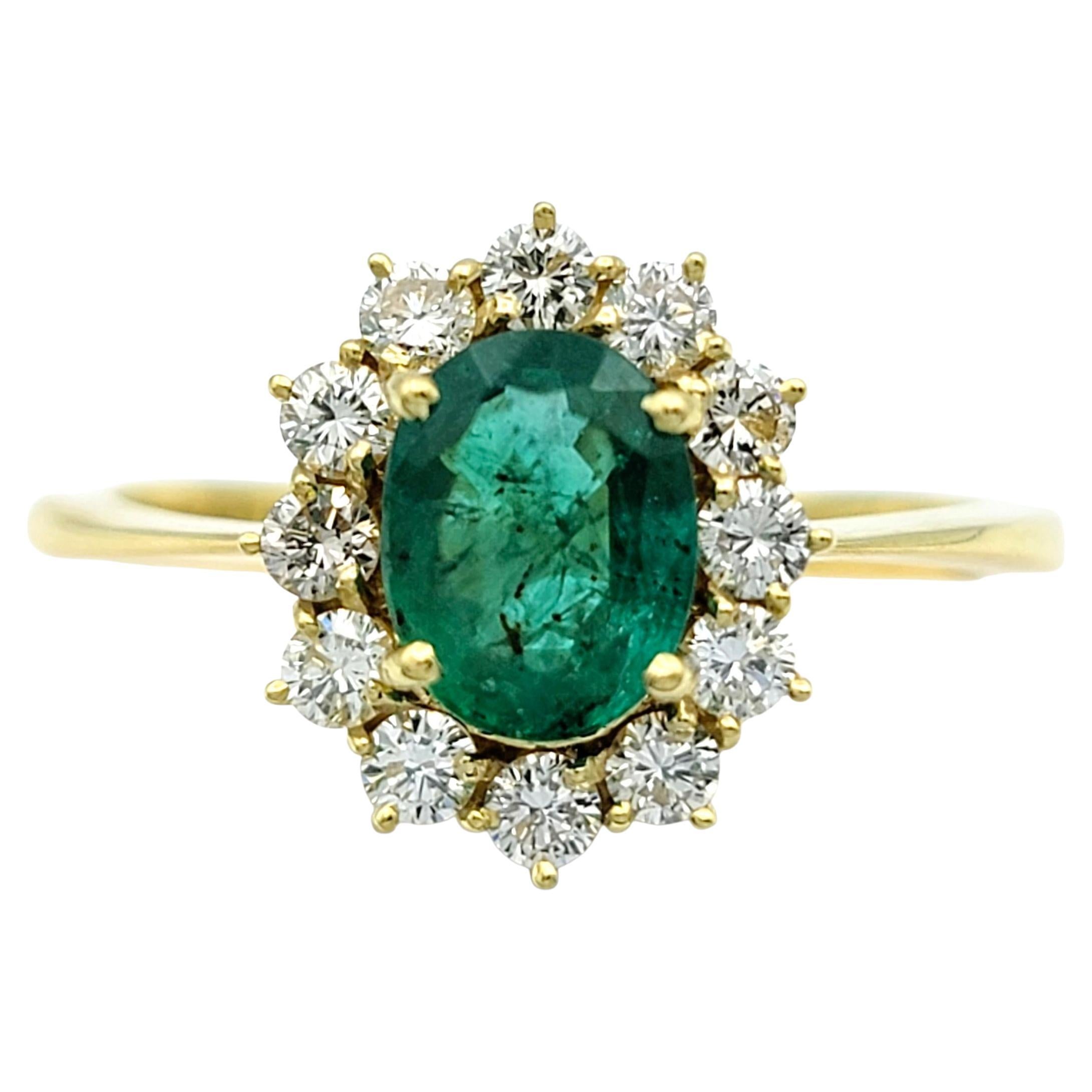 Oval Cut Emerald and Diamond Halo Cocktail Ring in 18 Karat Yellow Gold