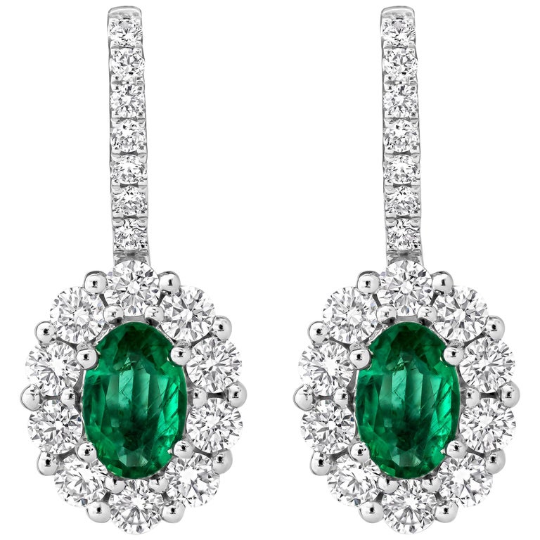 Oval Cut Emerald and Diamond Halo Lever-Back Earrings For Sale at 1stdibs