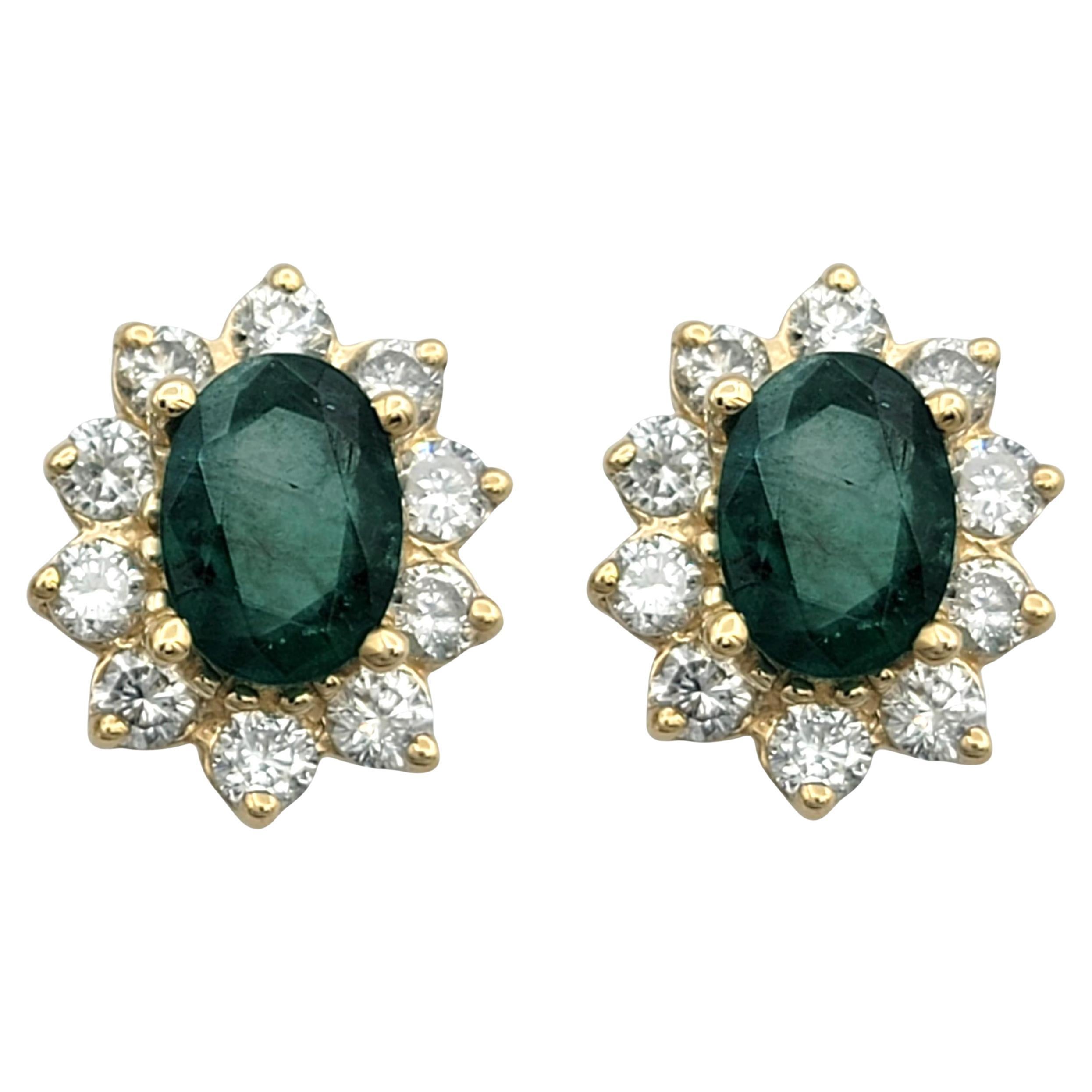 Oval Cut Emerald and Diamond Halo Stud Earrings in 14 Karat Yellow Gold im Angebot