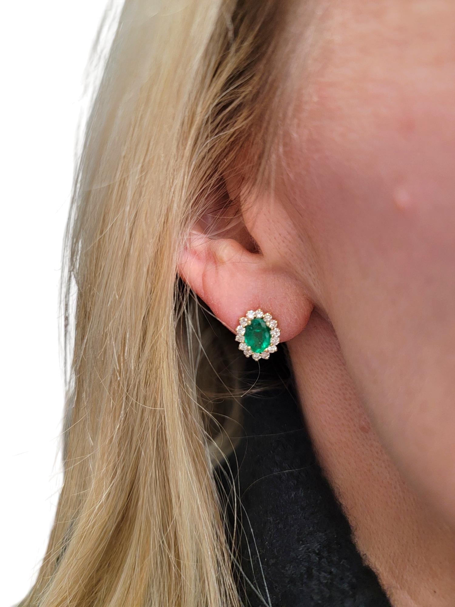 Oval Cut Emerald and Diamond Halo Stud Earrings in Polished 14 Karat Yellow Gold For Sale 6