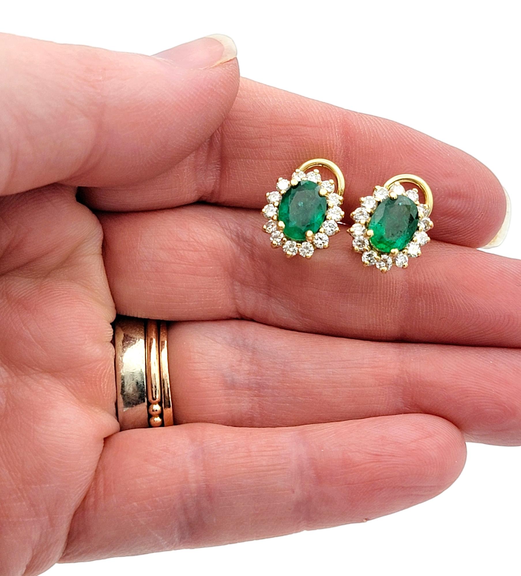 Oval Cut Emerald and Diamond Halo Stud Earrings in Polished 14 Karat Yellow Gold For Sale 4