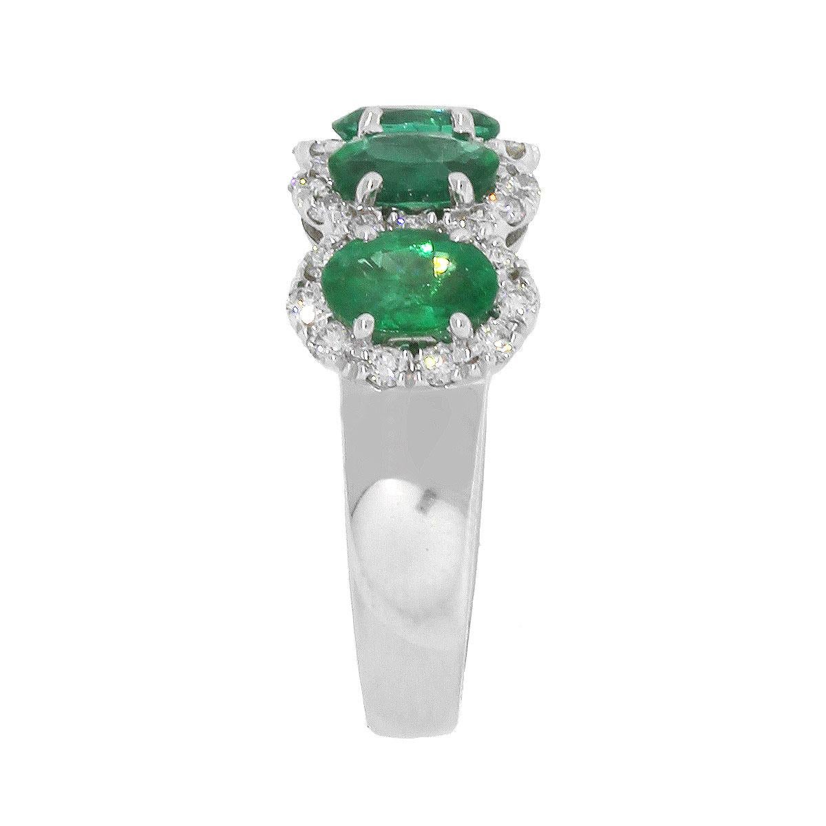 Material: 18k white gold
Emerald Details: 5 stones, Approximately 2.01ctw of Oval Cut Emeralds.
Round Diamond Details: Approximately 0.53ctw of round brilliant diamonds. Diamonds are G/H in color and SI in clarity
Size: 6.25
Total Weight: 6.7g