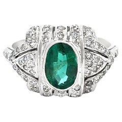 Oval Cut Emerald And Diamond Ring