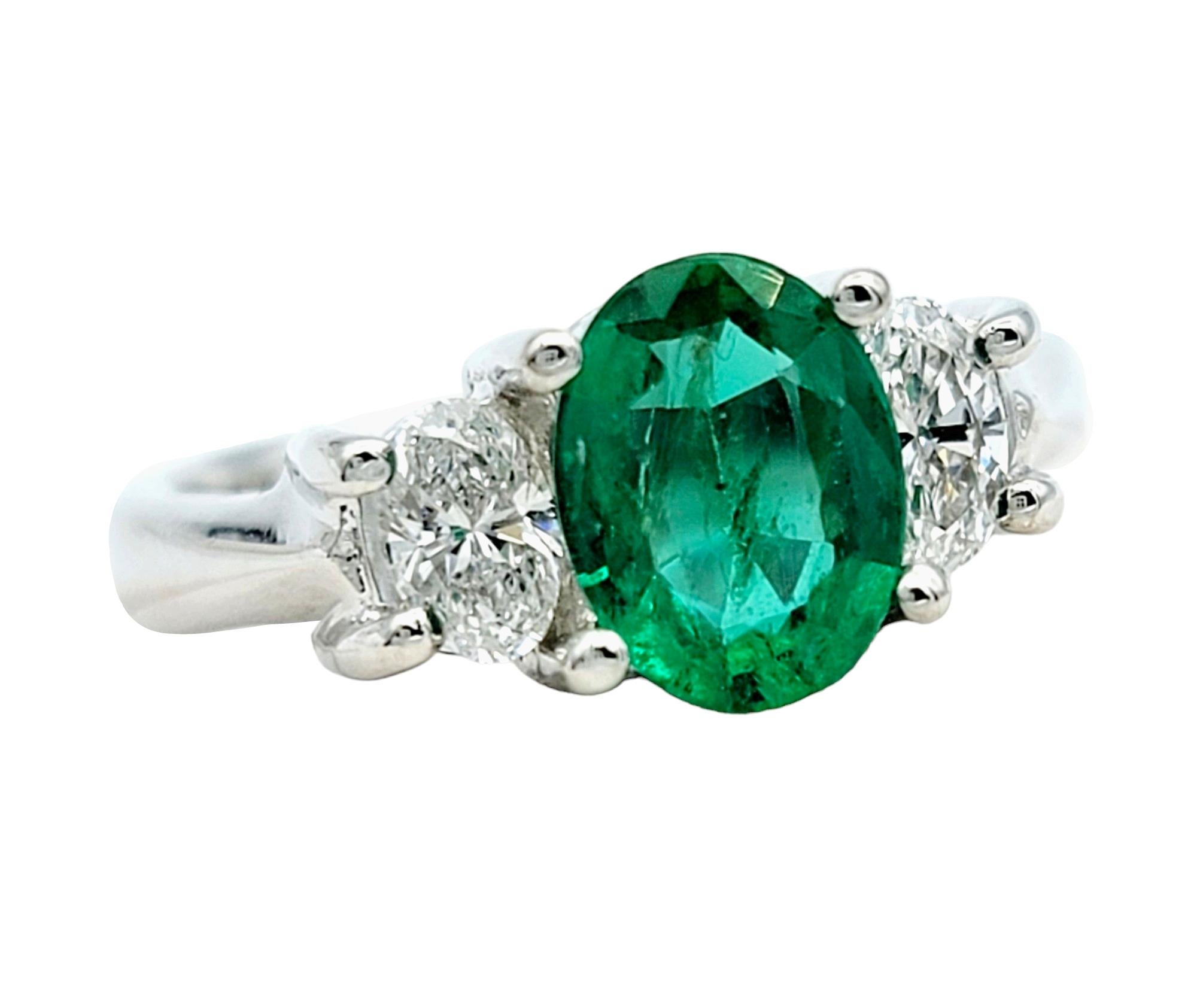 Ring size: 5.75

This stunning three stone ring combines the allure of deep green emeralds, sparkling diamonds, and luxurious 14K white gold to create a true timeless treasure.

The center stone of this gorgeous ring boasts a vibrant, oval-cut green