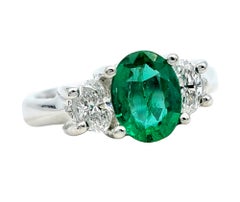 Oval Cut Emerald and Diamond Three Stone Ring in Polished 14 Karat White Gold