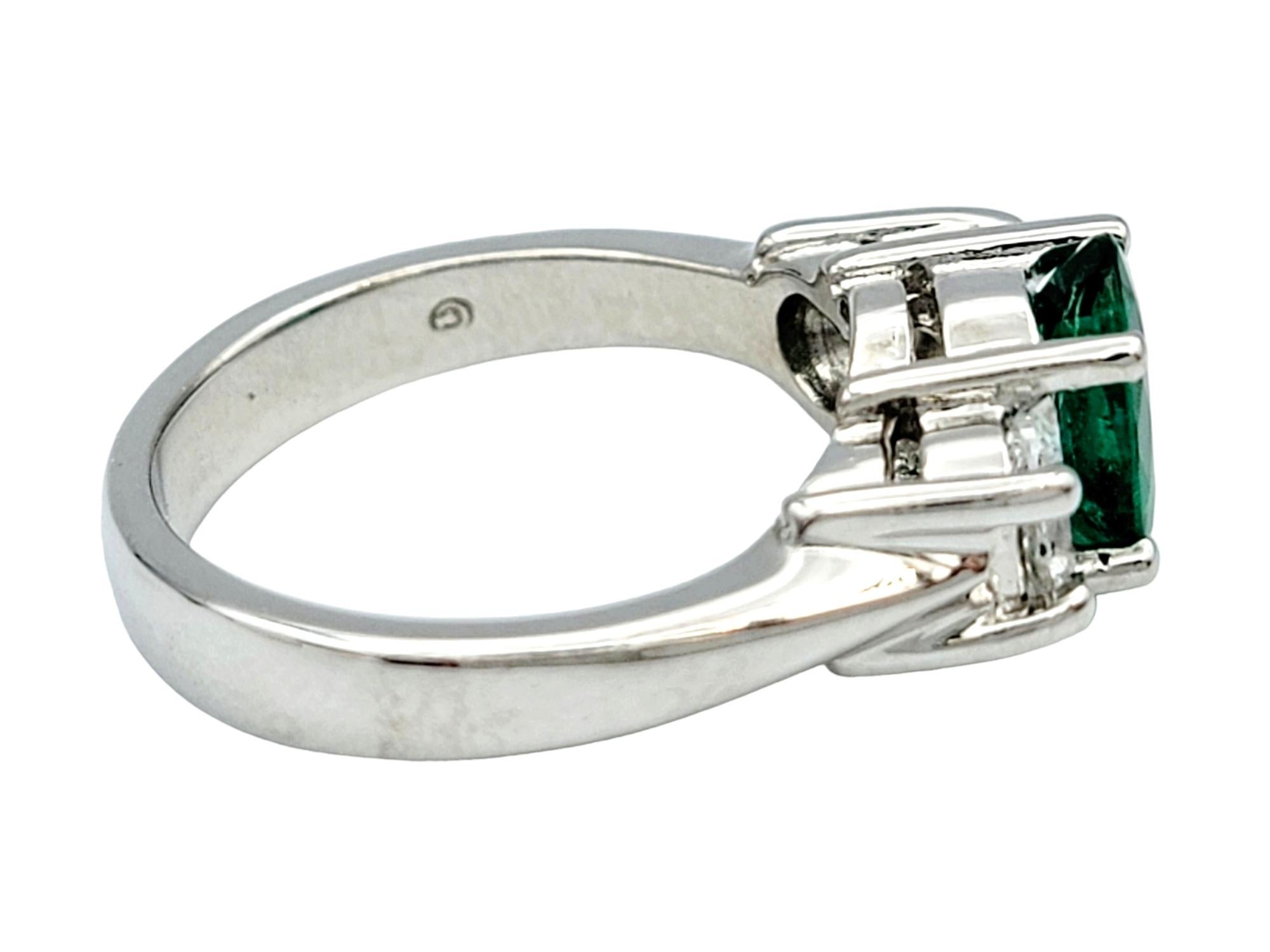 Oval Cut Emerald and Diamond Three Stone Ring in Polished 14 Karat White Gold In Good Condition For Sale In Scottsdale, AZ
