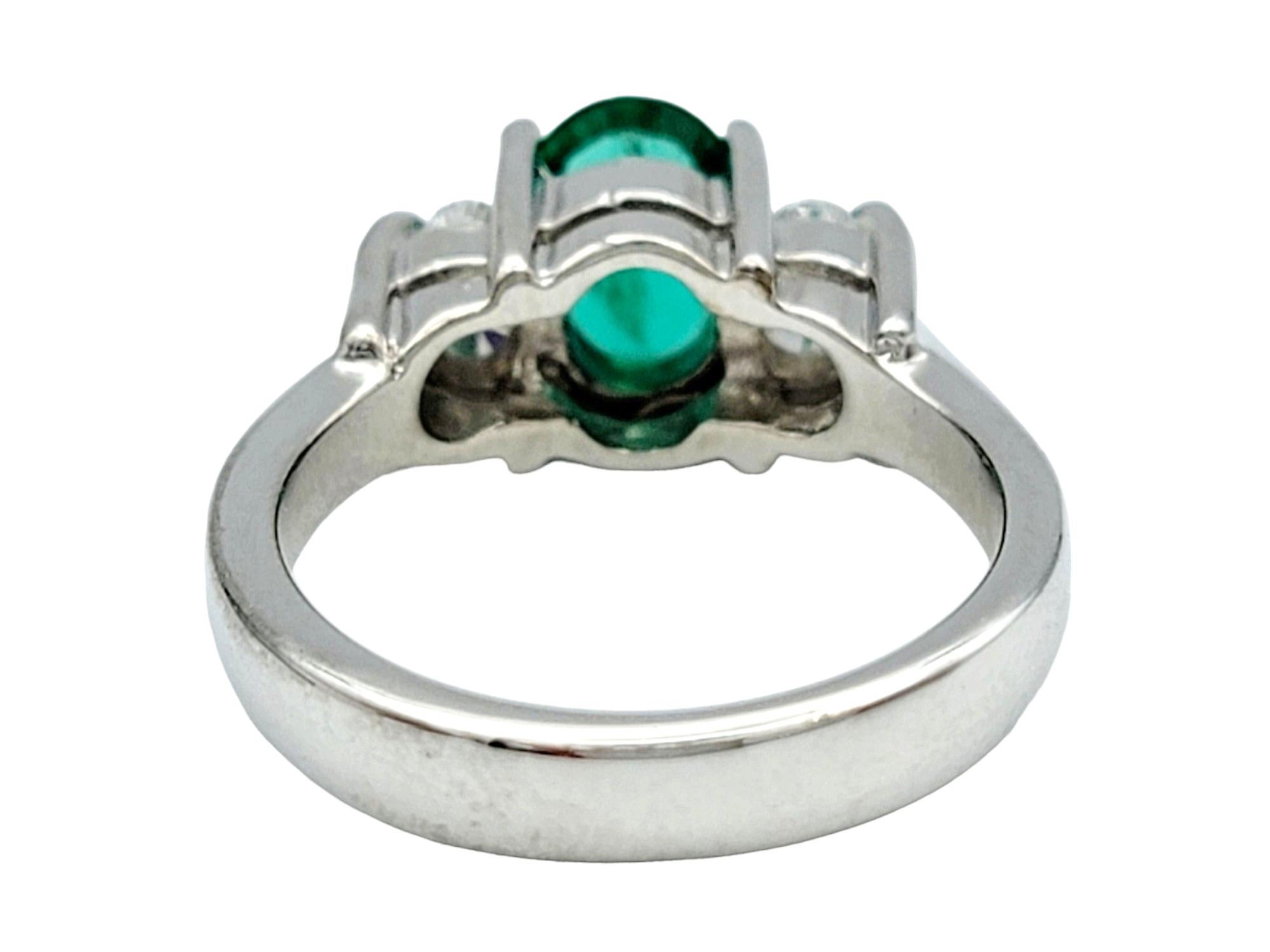 Women's Oval Cut Emerald and Diamond Three Stone Ring in Polished 14 Karat White Gold For Sale