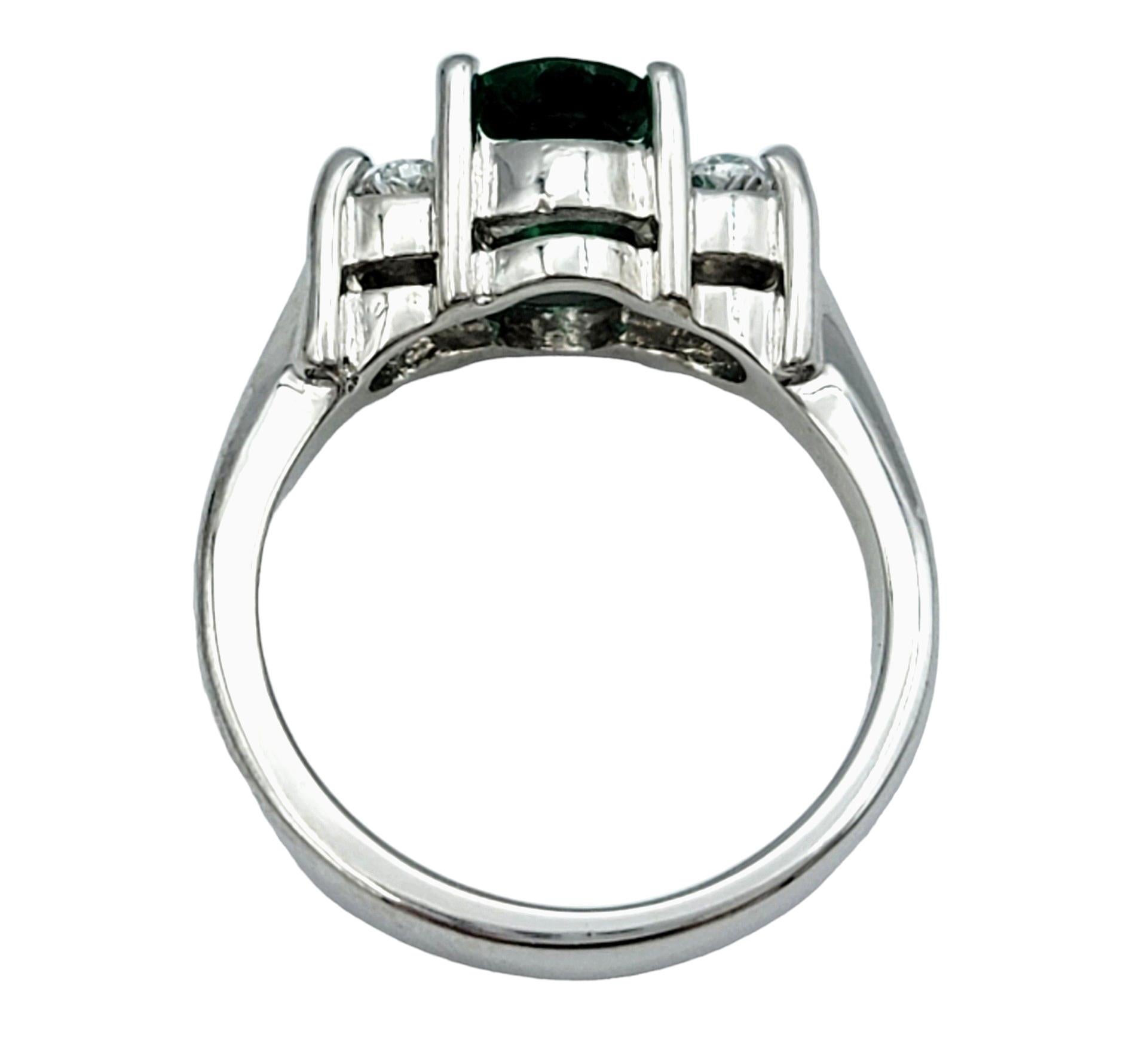 Oval Cut Emerald and Diamond Three Stone Ring in Polished 14 Karat White Gold For Sale 1
