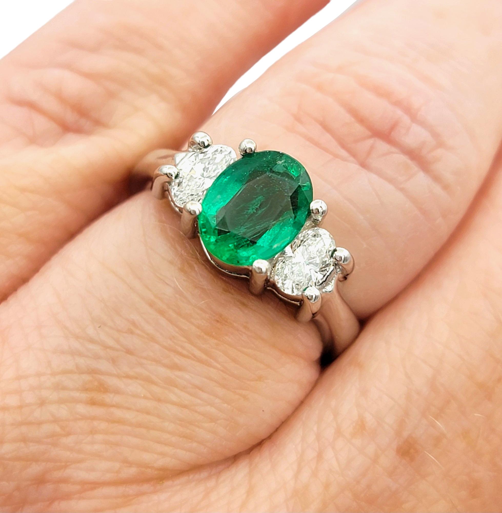 Oval Cut Emerald and Diamond Three Stone Ring in Polished 14 Karat White Gold For Sale 3