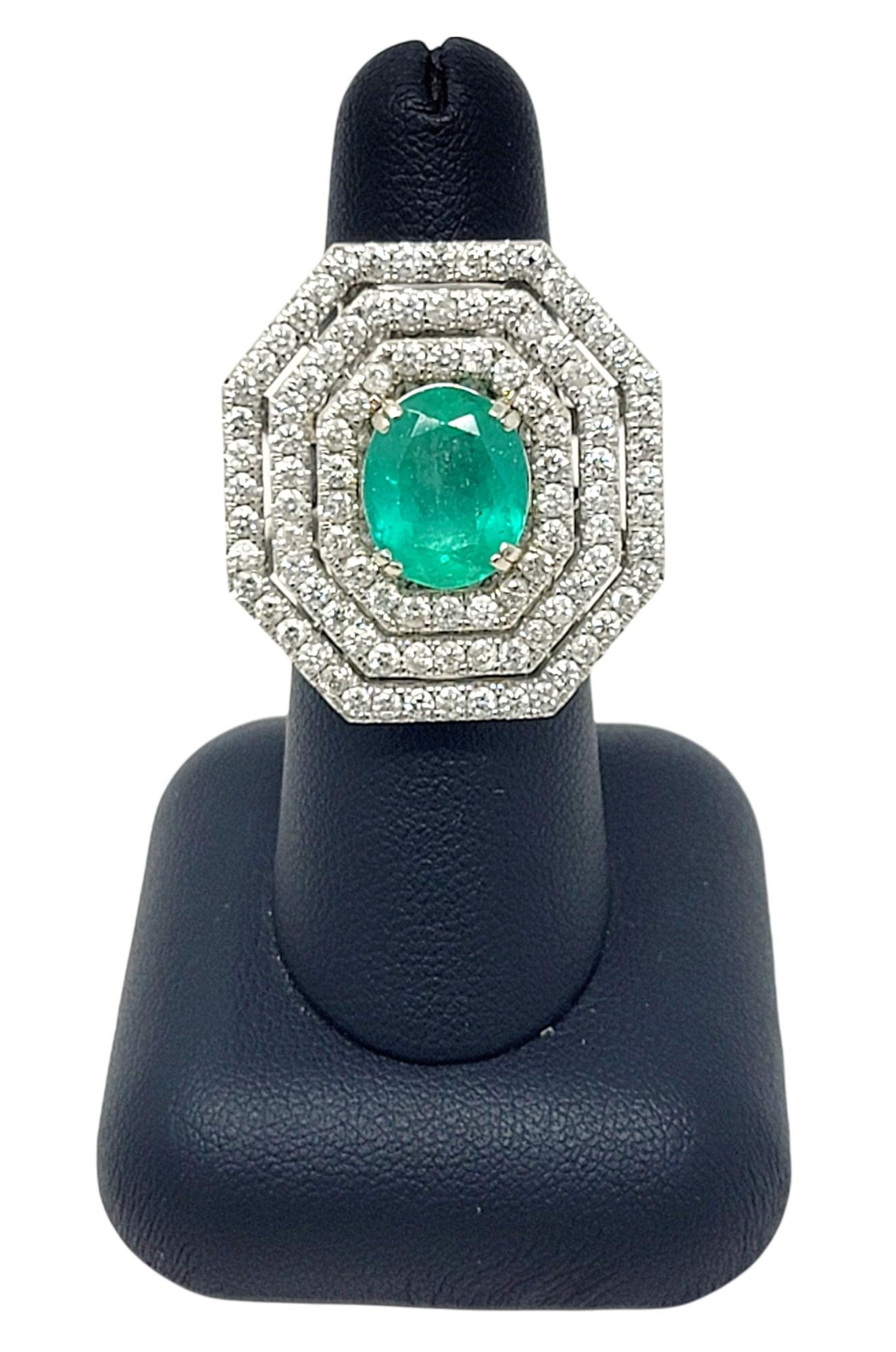 Oval Cut Emerald and Diamond Triple Halo Split Shank Cocktail Ring 14 Karat Gold For Sale 4