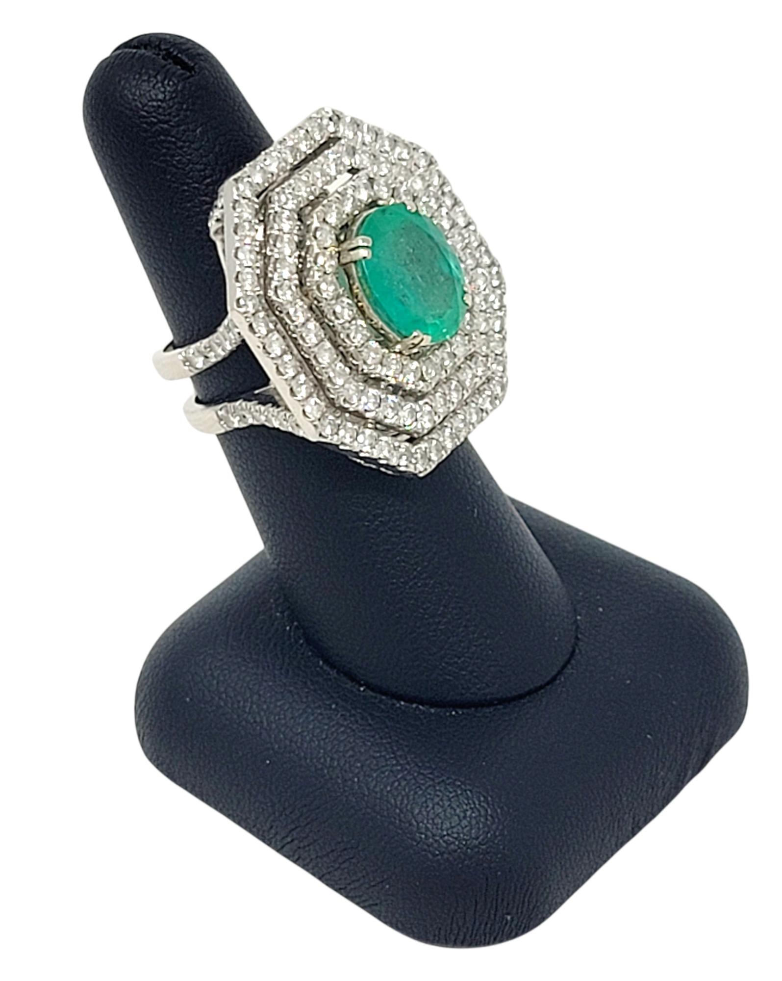 Oval Cut Emerald and Diamond Triple Halo Split Shank Cocktail Ring 14 Karat Gold For Sale 5