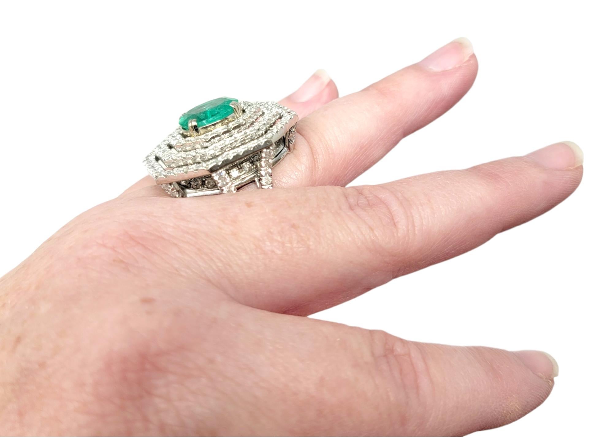 Oval Cut Emerald and Diamond Triple Halo Split Shank Cocktail Ring 14 Karat Gold For Sale 7