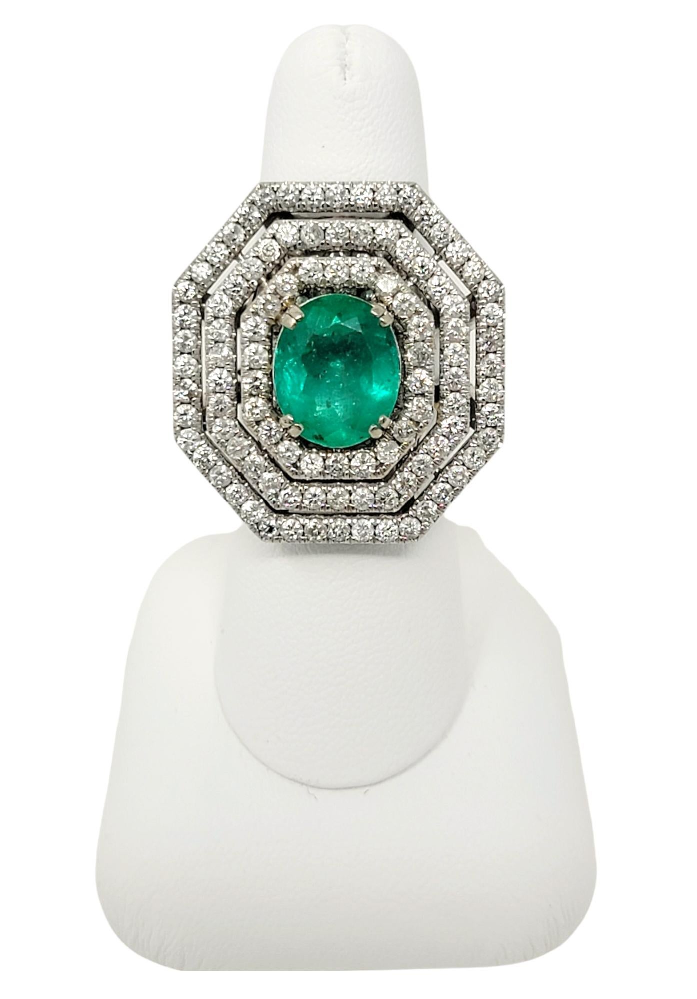 Oval Cut Emerald and Diamond Triple Halo Split Shank Cocktail Ring 14 Karat Gold For Sale 8