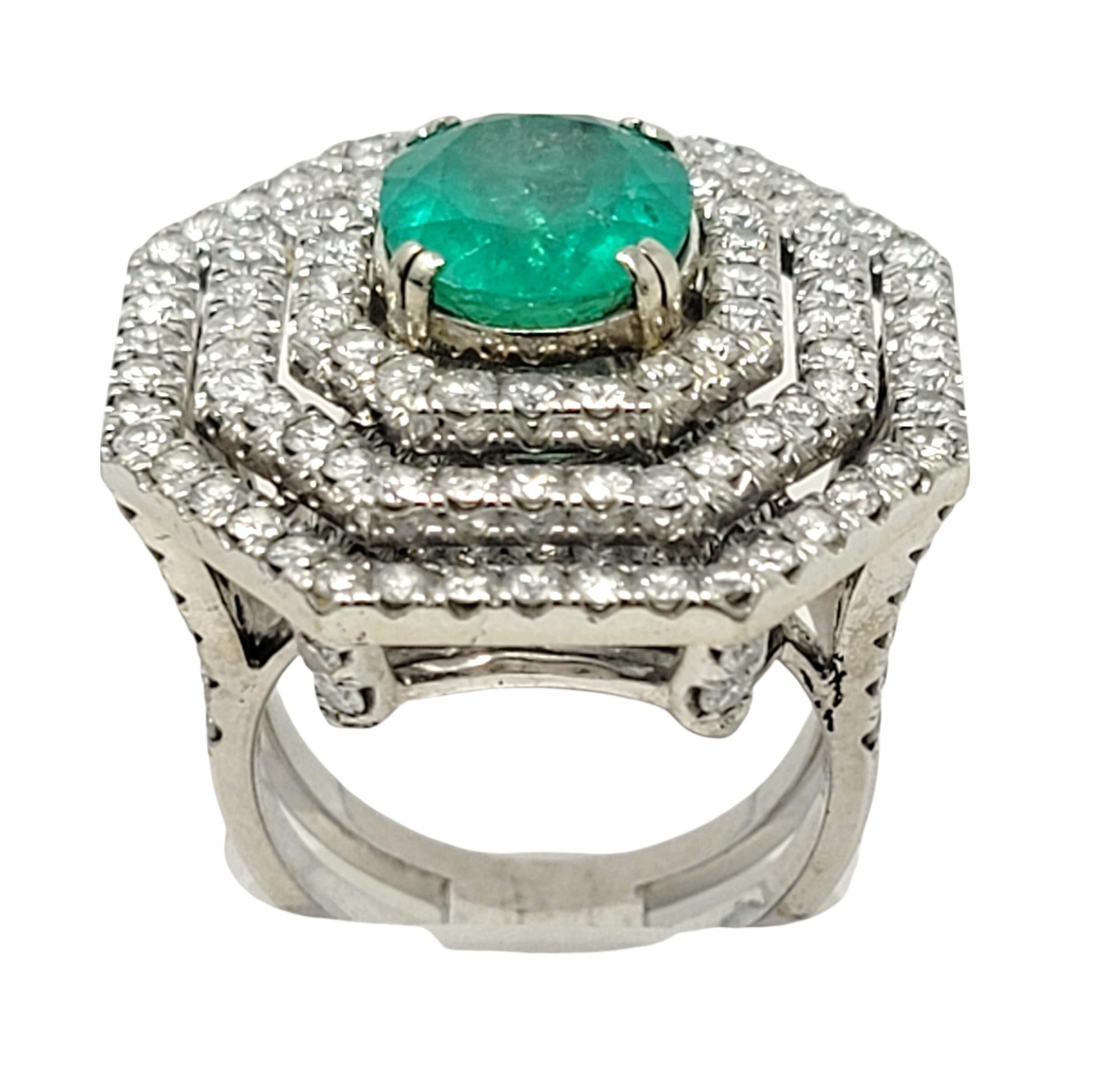 Oval Cut Emerald and Diamond Triple Halo Split Shank Cocktail Ring 14 Karat Gold In Good Condition For Sale In Scottsdale, AZ