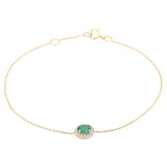 Bracciale a catena con smeraldo taglio ovale e diamanti a raggiera in oro giallo 14K