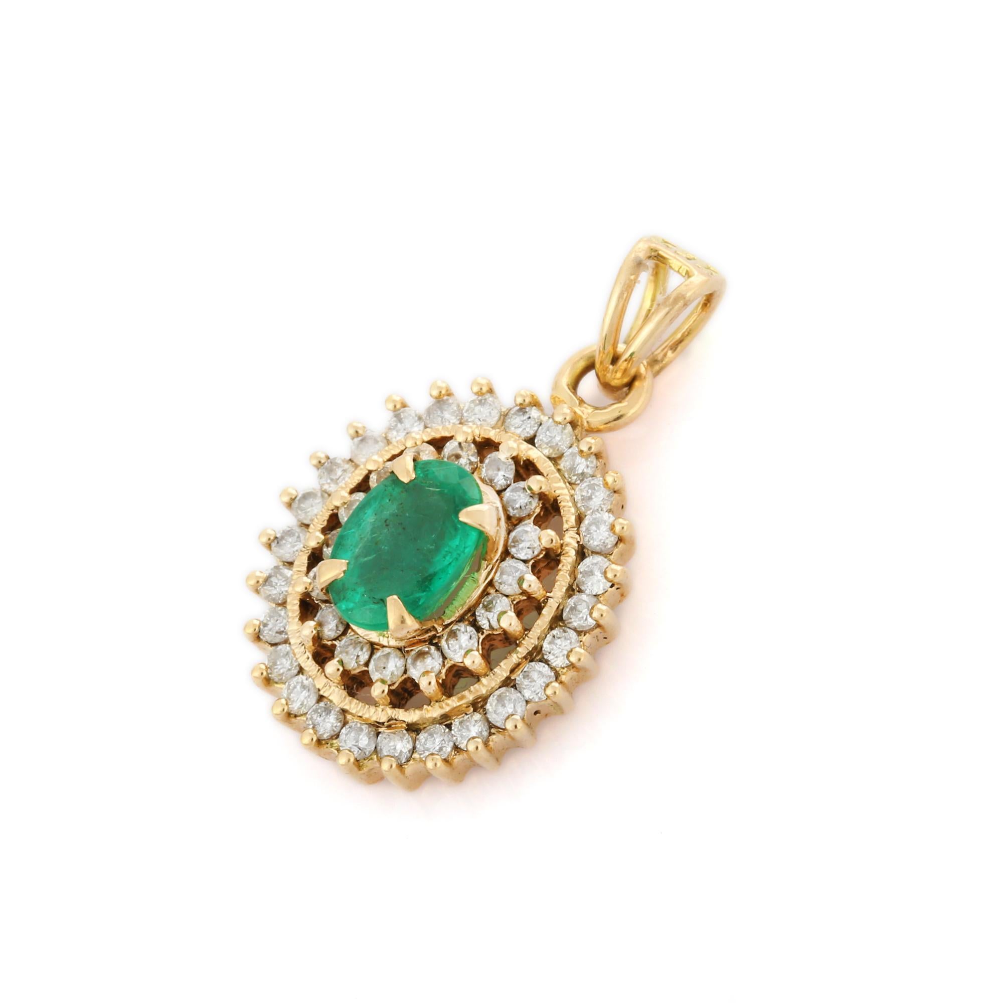 Women's Oval Cut Emerald and Halo Diamond Pendant Necklace in 14K Yellow Gold For Sale
