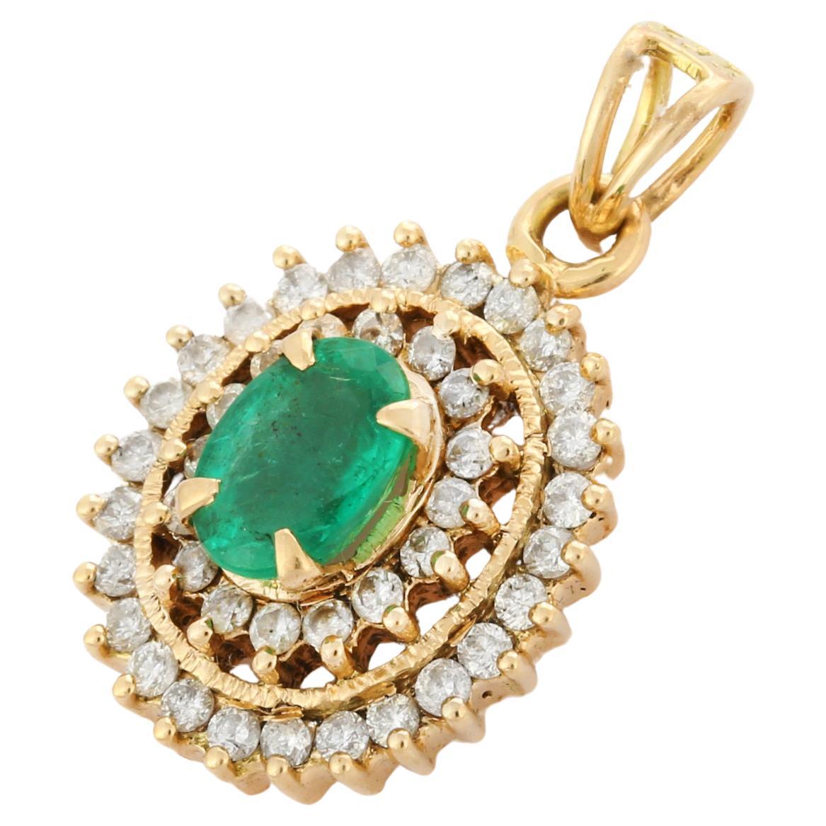 Oval Cut Emerald and Halo Diamond Pendant Necklace in 14K Yellow Gold For Sale