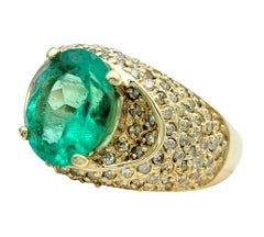 Oval Cut Emerald and Pave Diamond Domed Band Ring in 14 Karat Yellow Gold