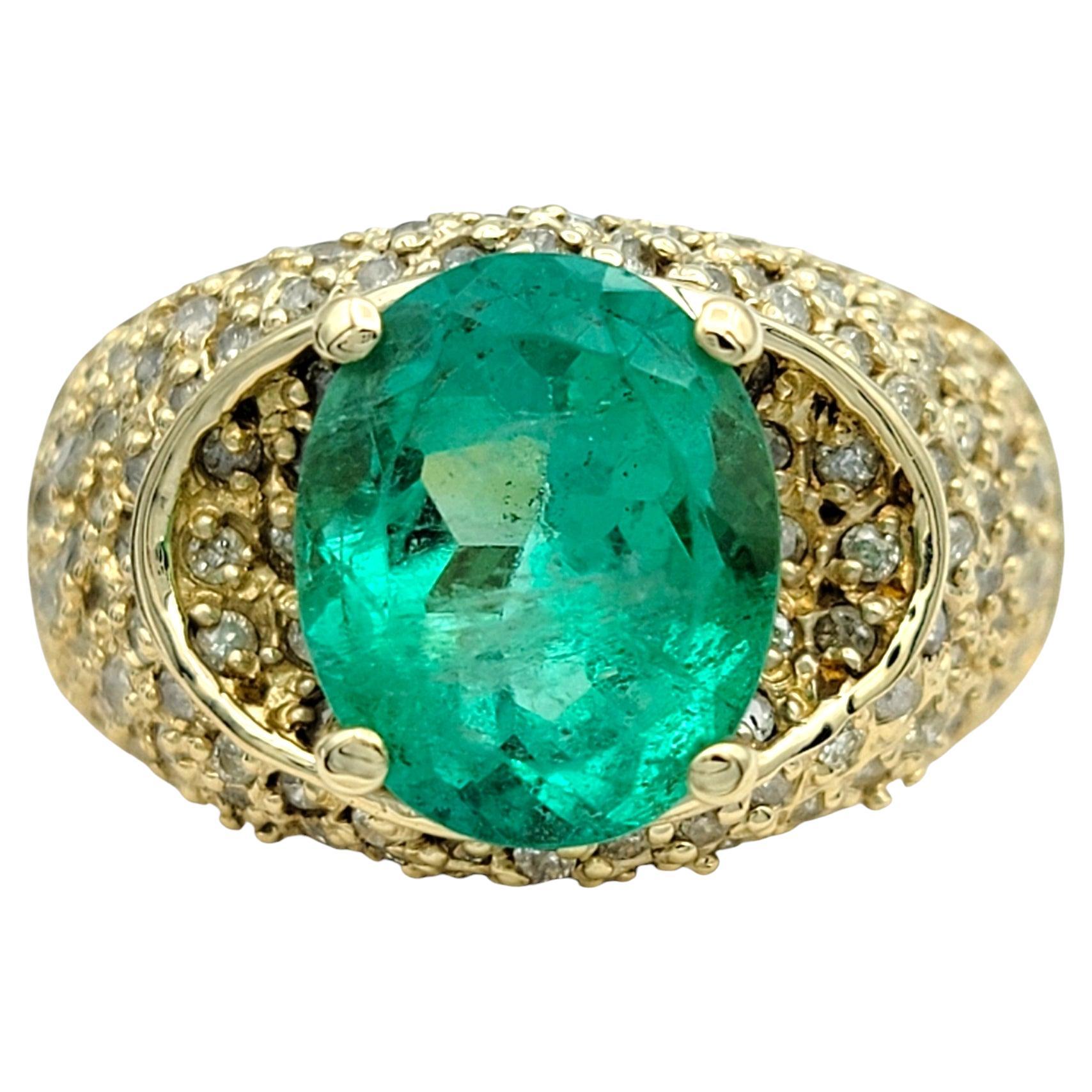Oval Cut Emerald and Pave Diamond Domed Band Ring in 14 Karat Yellow Gold For Sale