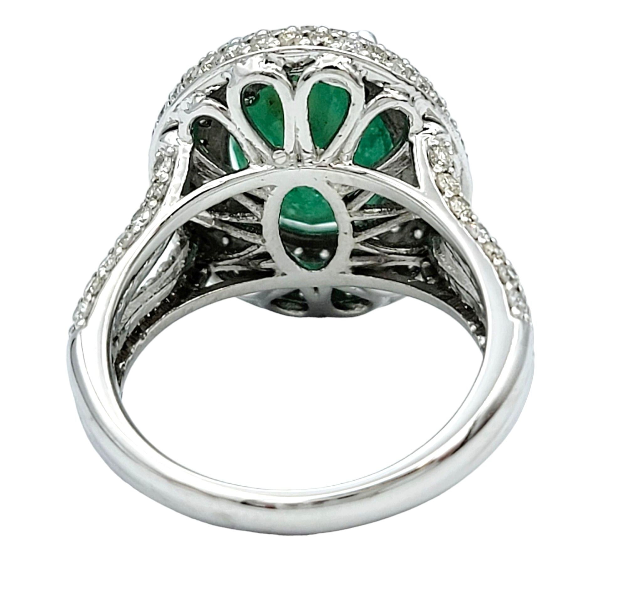 Women's Oval Cut Emerald and Pavé Diamond Double Halo Cocktail Ring 14 Karat White Gold For Sale