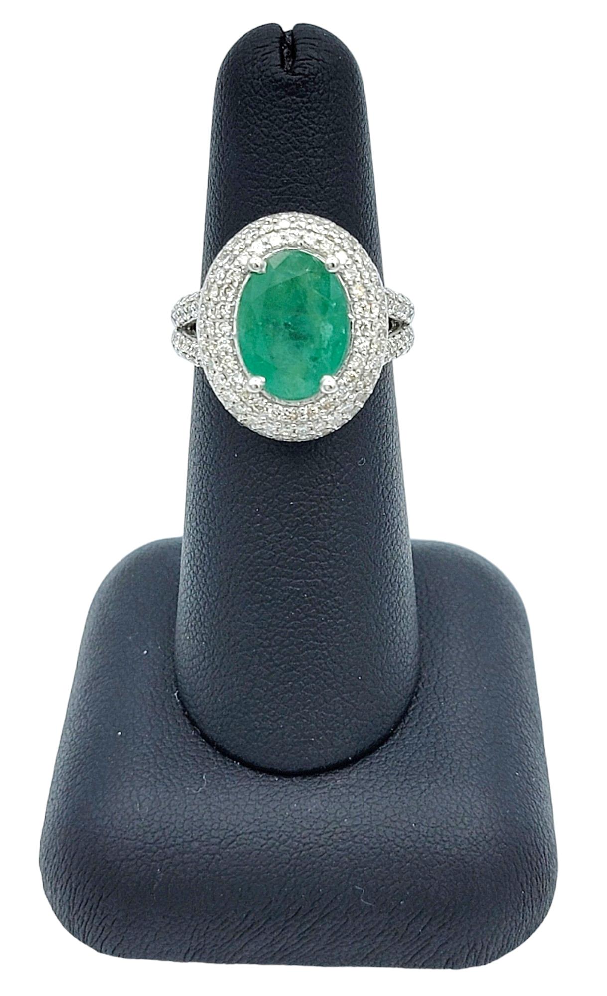 Oval Cut Emerald and Pavé Diamond Double Halo Cocktail Ring 14 Karat White Gold For Sale 2