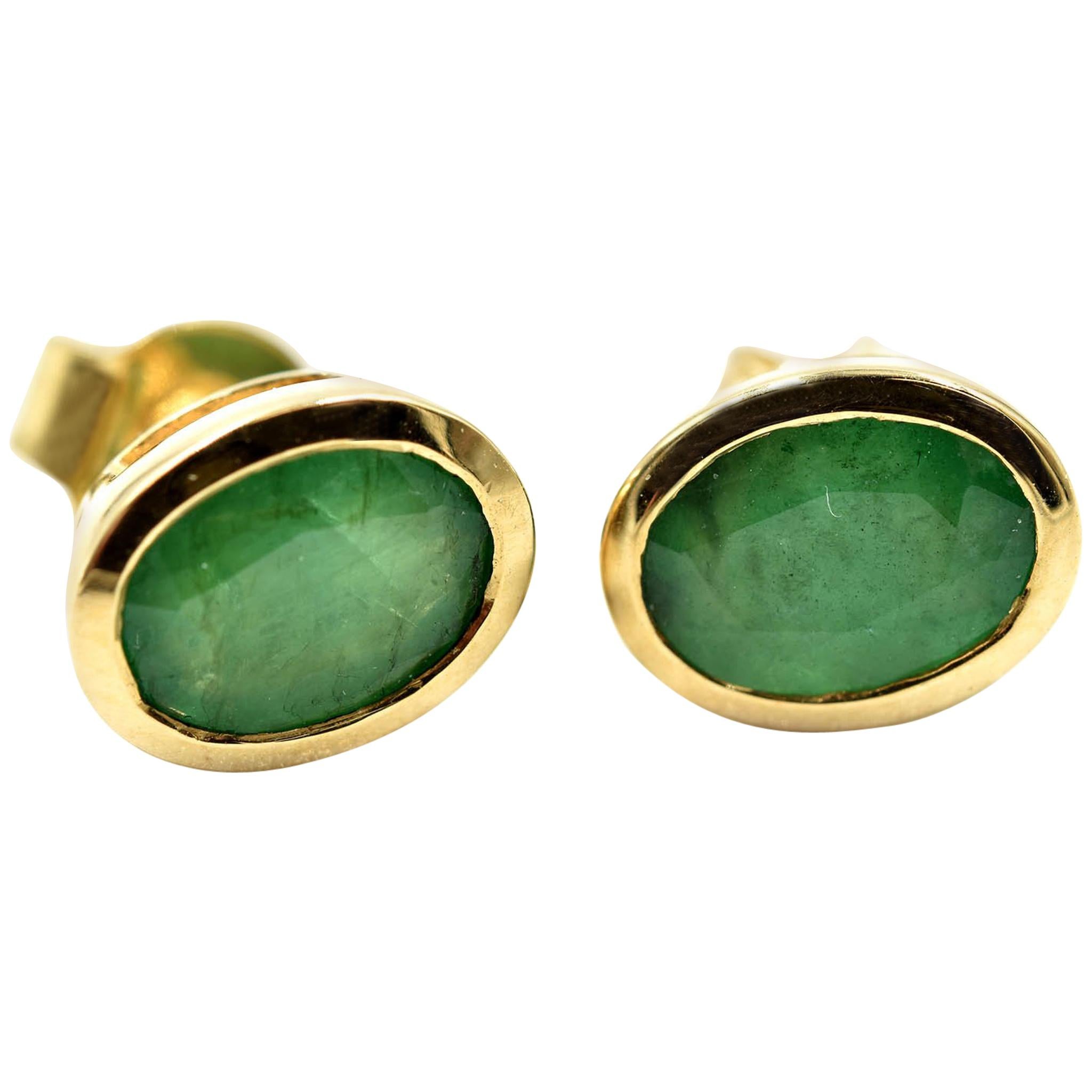 Oval Cut Emerald Bezel Set Stud Earrings 14 Karat Yellow Gold
