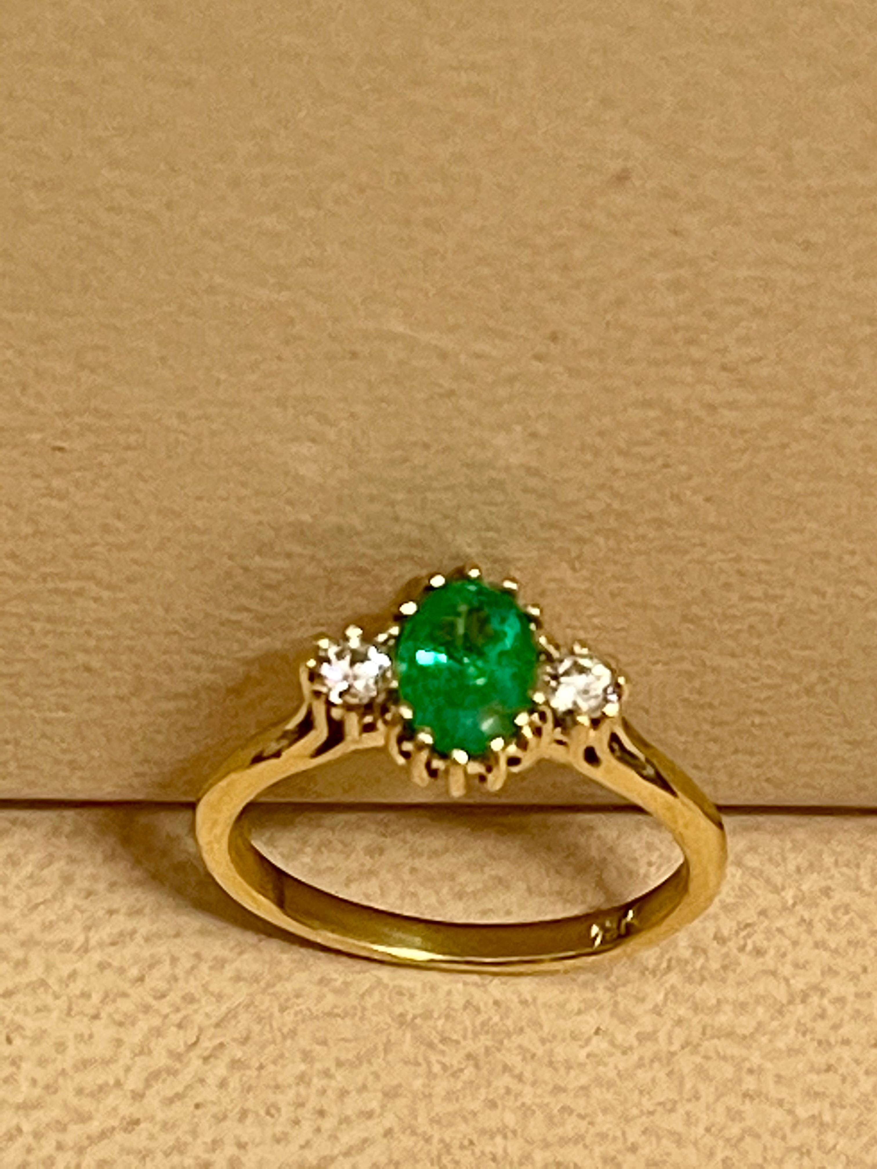 
Approximately 0.80  Carat Oval Cut  Emerald &  Diamond Ring In 18 Karat Yellow  Gold Size 6.5
A Classic, ring 
Absolutely gorgeous emerald , Very desirable color ,  good  quality ,color and luster
 Stone  has black dots called inclusions which all