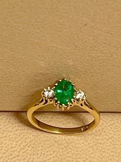Oval Cut Emerald & Diamond Ring in 18 Karat Yellow Gold