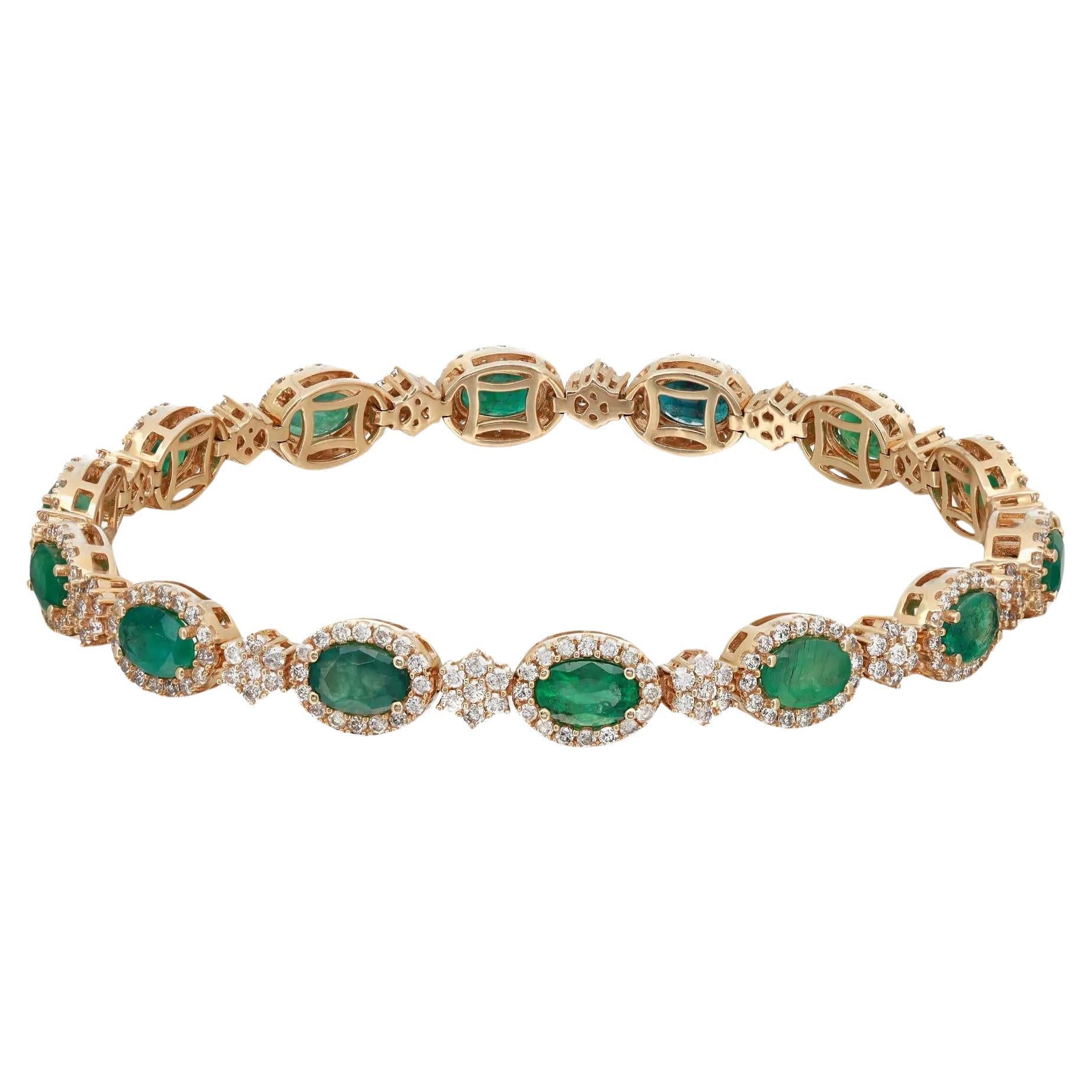 Add a colorful touch of sparkle to your wrist with this gorgeous tennis bracelet from the Rachel Koen collection. Crafted in lustrous 14K yellow gold. It features 14 prong set oval cut emeralds highlighted with round brilliant cut diamond halo and