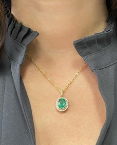 1.68 Carat Oval Emerald Double Halo 14K Yellow Gold Necklace 0.32 Carat Diamonds