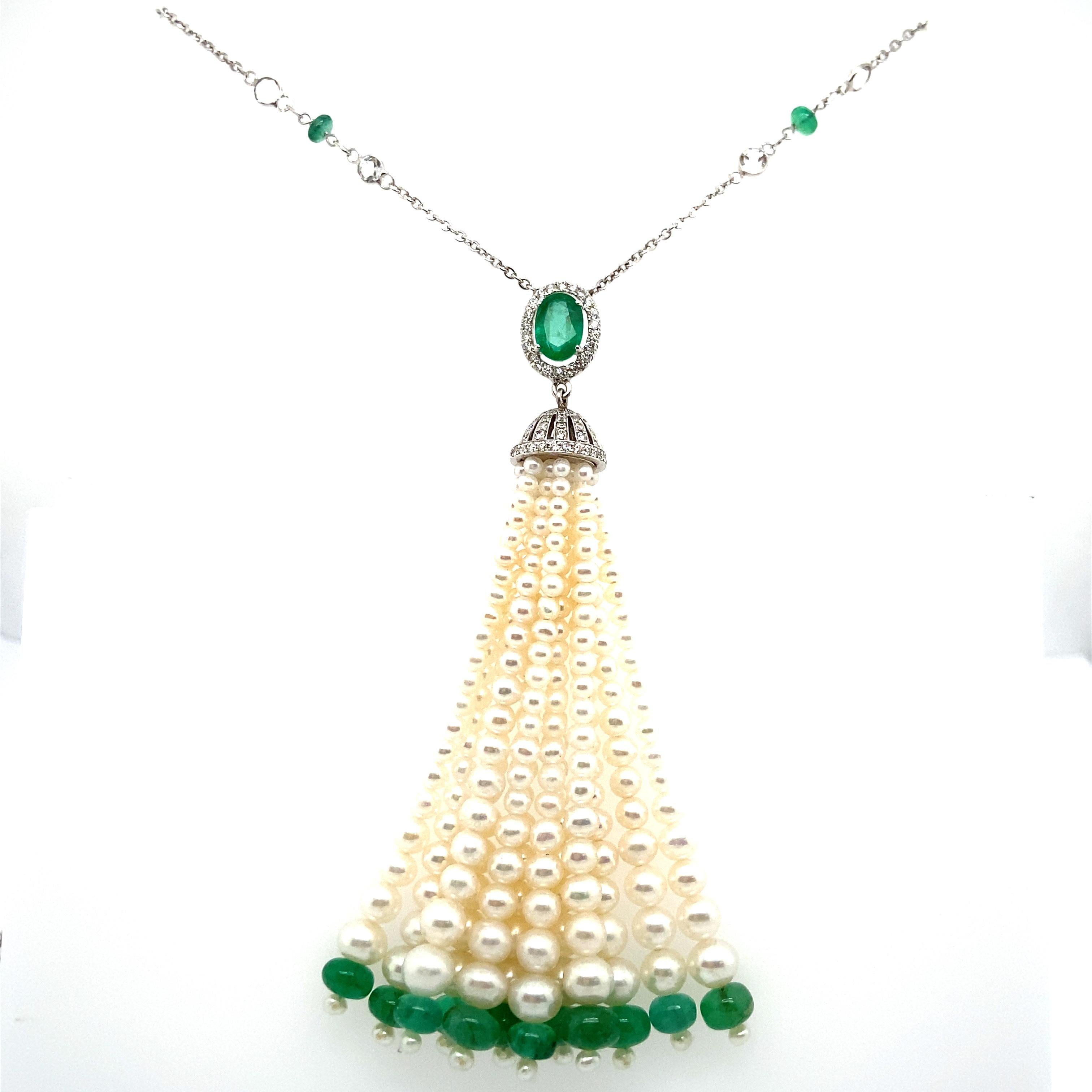 Oval-cut Emerald, Emerald Beads, Pearls, and White Diamond Gold Tassel Necklace:

An elegant tassel necklace, it features an oval-cut natural emerald weighing 2.74 carat, along with emerald beads weighing 13.20 carat, pearls weighing 10.52 carat,