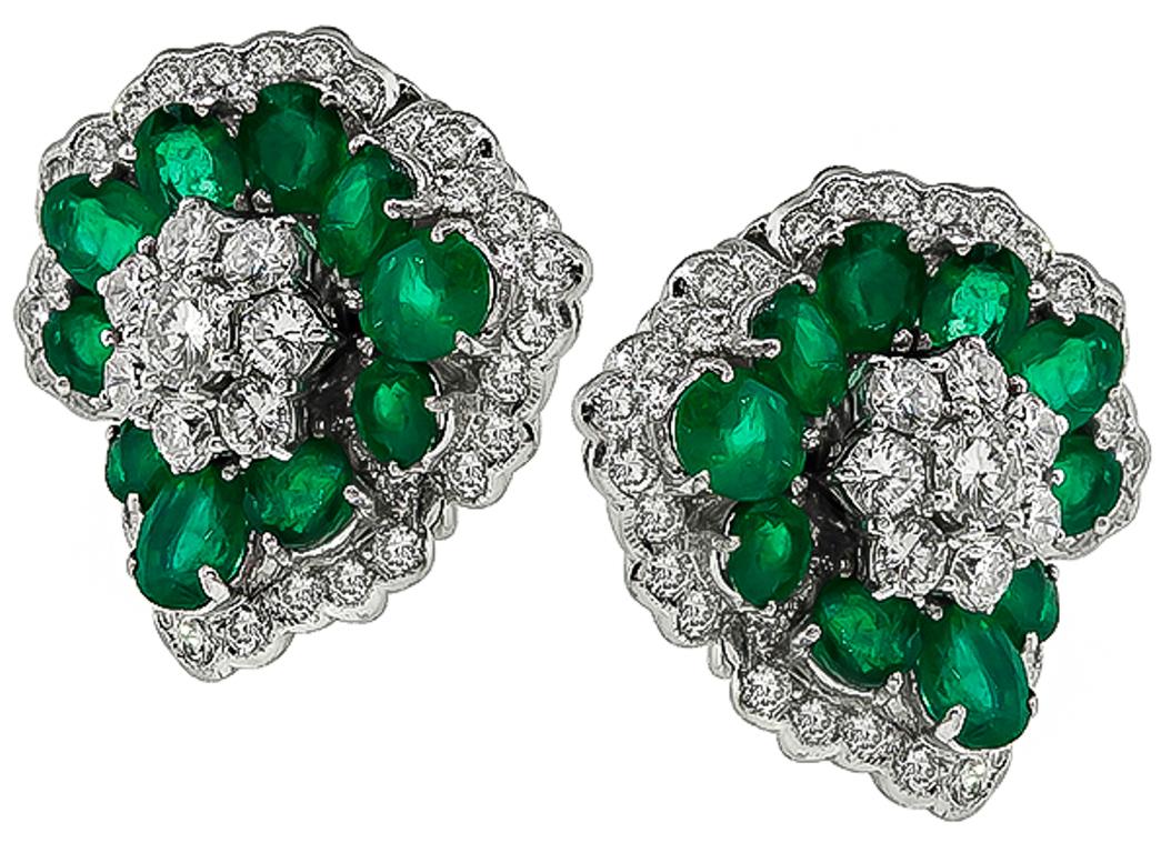 Made of 18k white gold, these earrings feature high quality oval cut emeralds that weigh approximately 7.00ct. The emeralds are accentuated by sparkling round cut diamonds that weigh approximately 3.50ct. graded F-G color with VS2 clarity. The