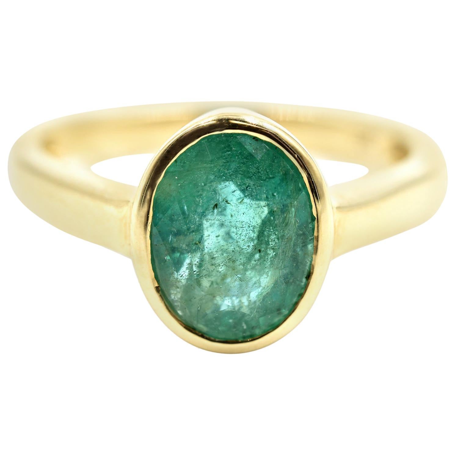 Oval Cut Emerald Solitaire Ring 14 Karat Yellow Gold