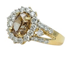 Oval Cut Fancy Light Brown and White Diamond Halo Ring in 14 Karat Yellow Gold