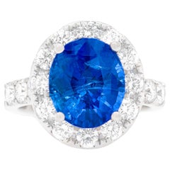 Fine Sapphire 6.21 Carat Ring With Diamond Halo 1.54 Carats Total 18K Gold