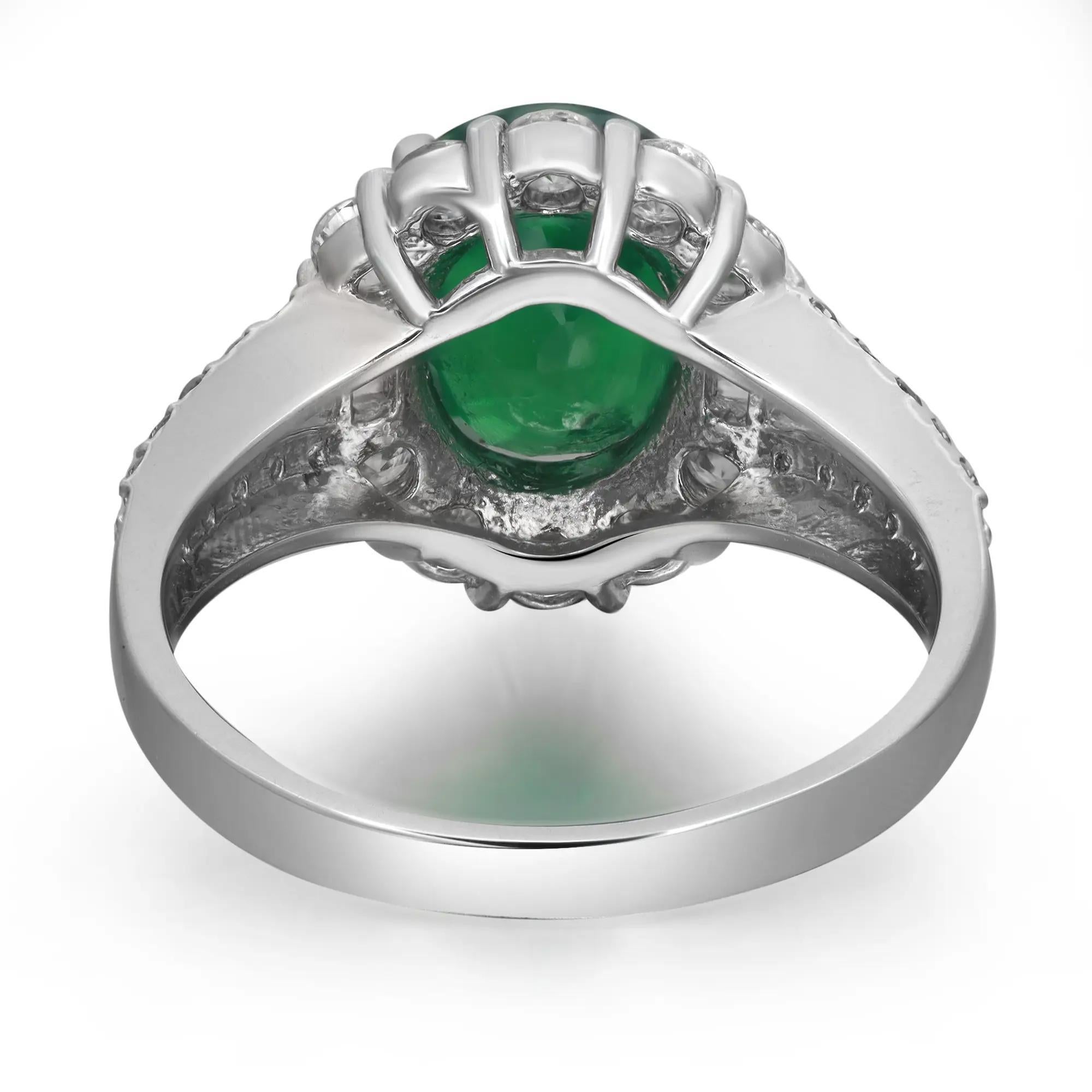 Dieser prächtige Cocktailring ist aus glänzendem Platin gefertigt. Der ovale Granat mit einem Gewicht von 2,90 Karat wird von einem funkelnden Halo aus Diamanten im Rund- und Baguetteschliff umrahmt, die in einen geteilten Schaft mit einem Gewicht