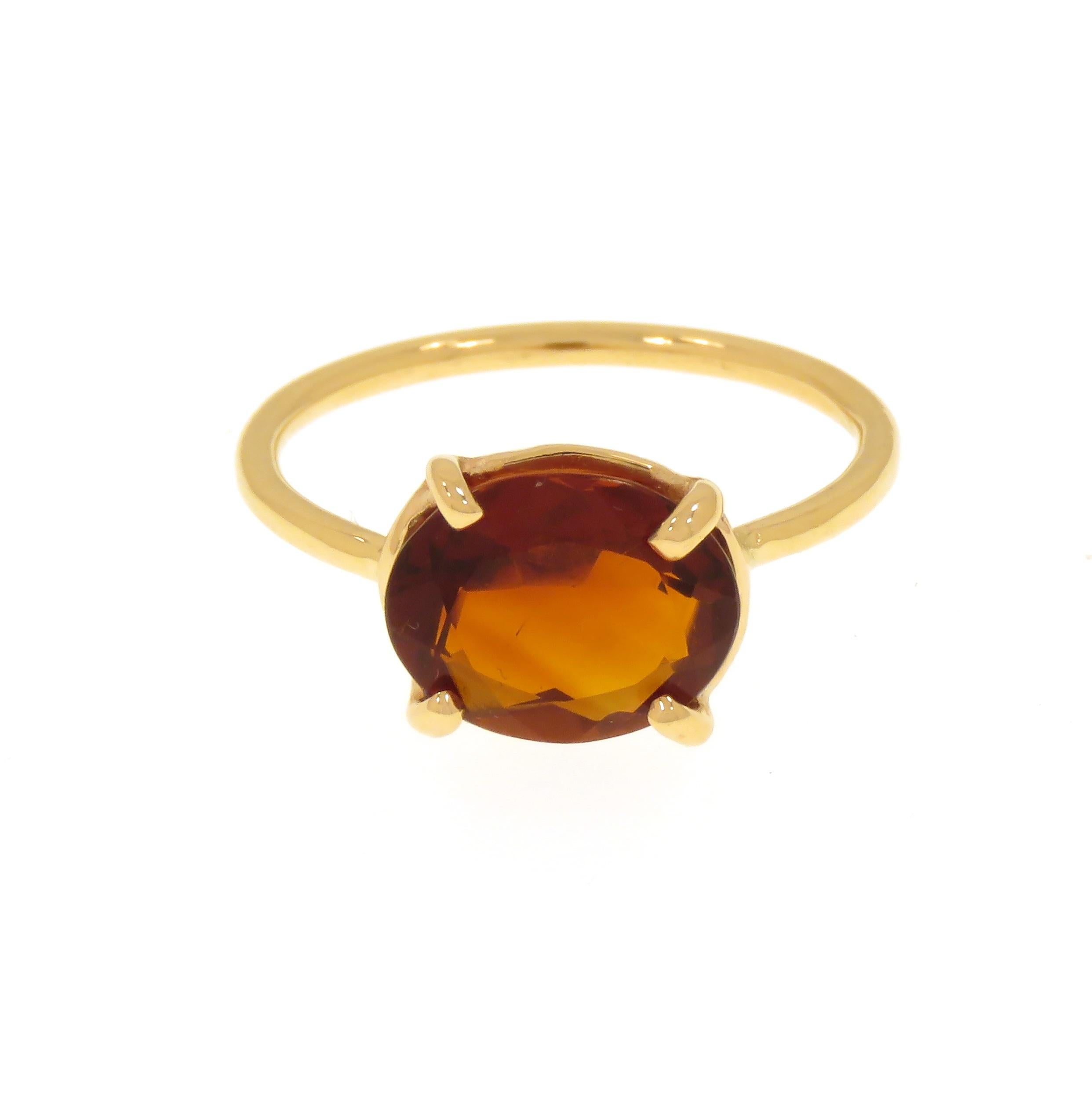 Sophisticated ring handcrafted in 9k rose gold featuring an oval cut natural garnet. The dimension of the gemstone is  10x8 millimeters /  0.393x0.314 inches. Us finger size is 6.5 / Italian size  13 / French size 53. Adjustable to the customer's