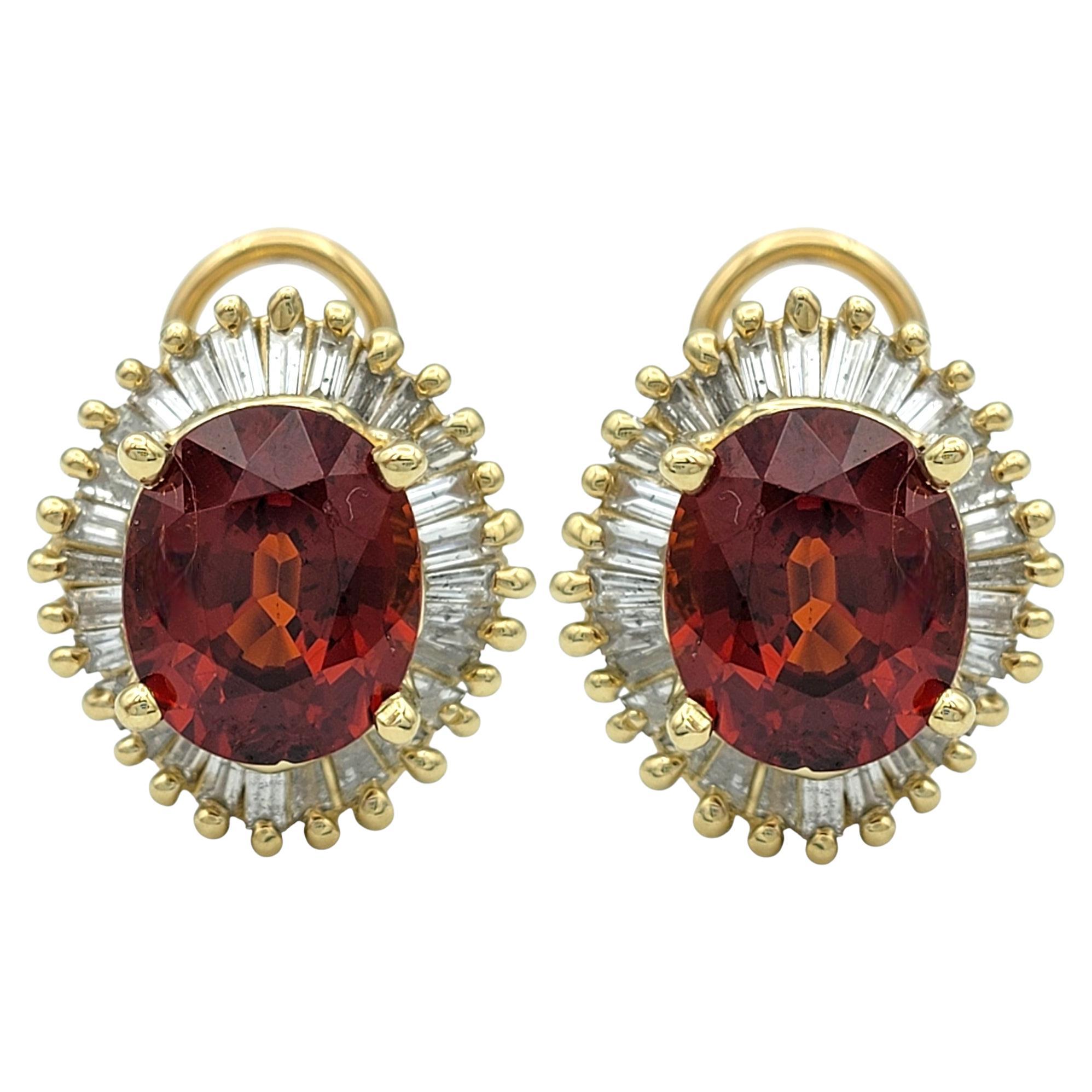 Add a fiery touch of elegance to your collection with these striking hessonite garnet and diamond earrings, beautifully crafted in 14 karat yellow gold. The centerpiece of each earring is a stunning oval-cut hessonite garnet, showcasing a vibrant