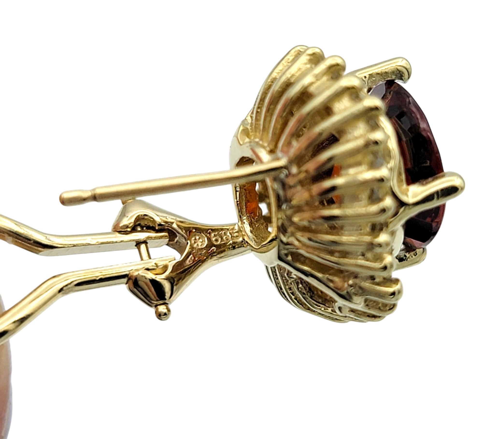Oval Cut Garnet and Baguette Diamond Halo Stud Earrings in 14 Karat Yellow Gold For Sale 1