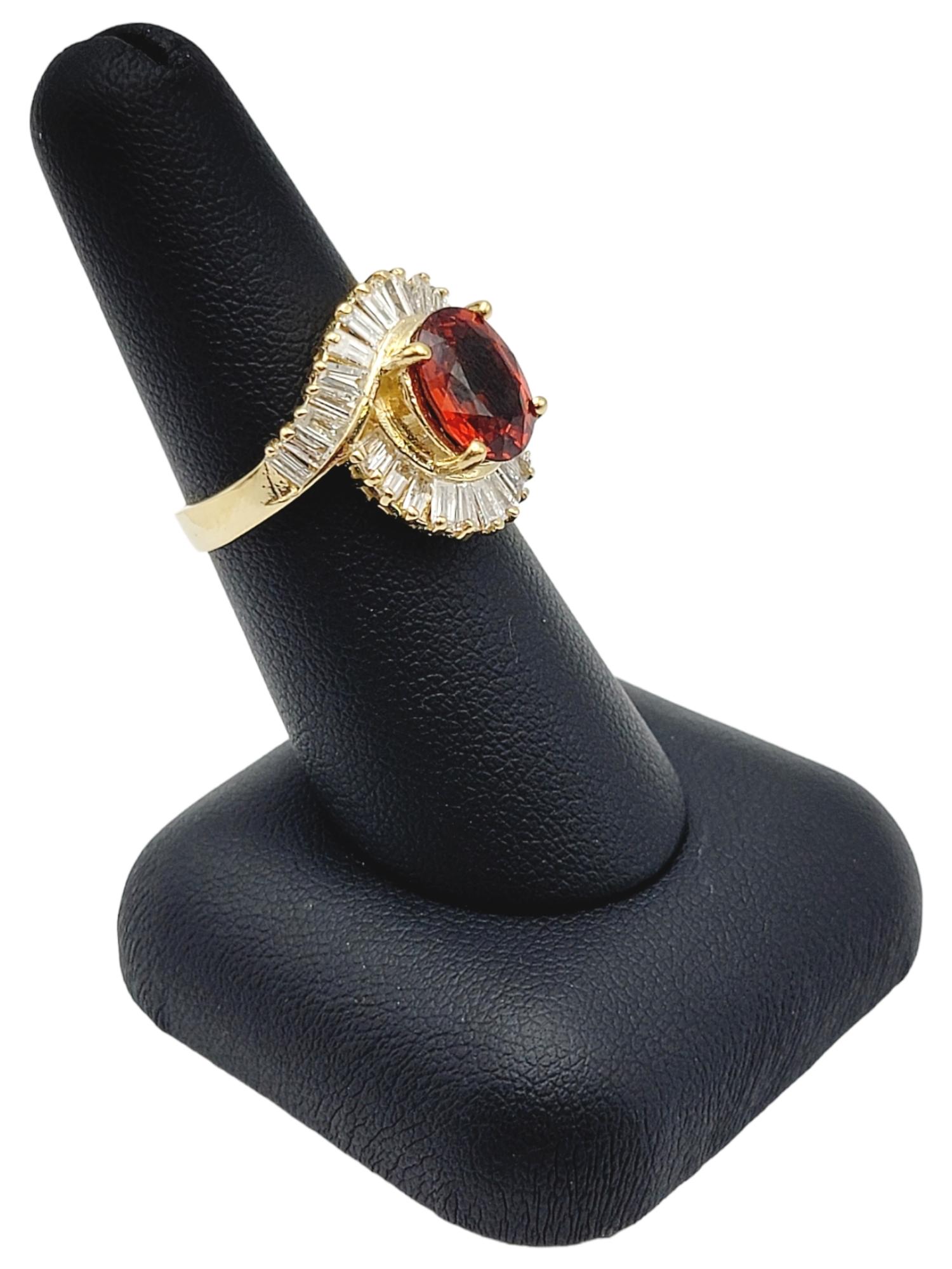 Oval Cut Garnet and Baguette Diamond Swirl Halo Cocktail Ring in 14 Karat Gold For Sale 5