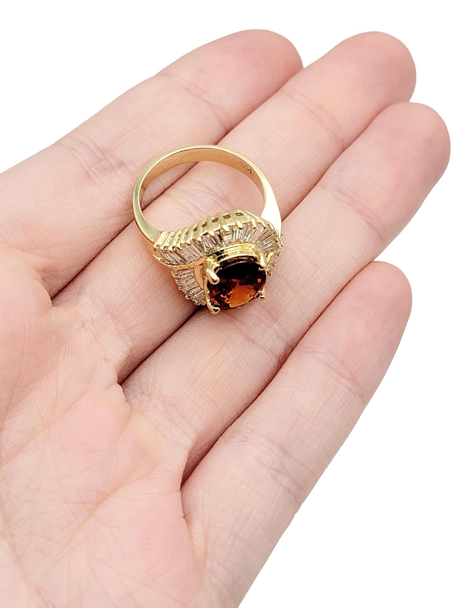 Oval Cut Garnet and Baguette Diamond Swirl Halo Cocktail Ring in 14 Karat Gold For Sale 6