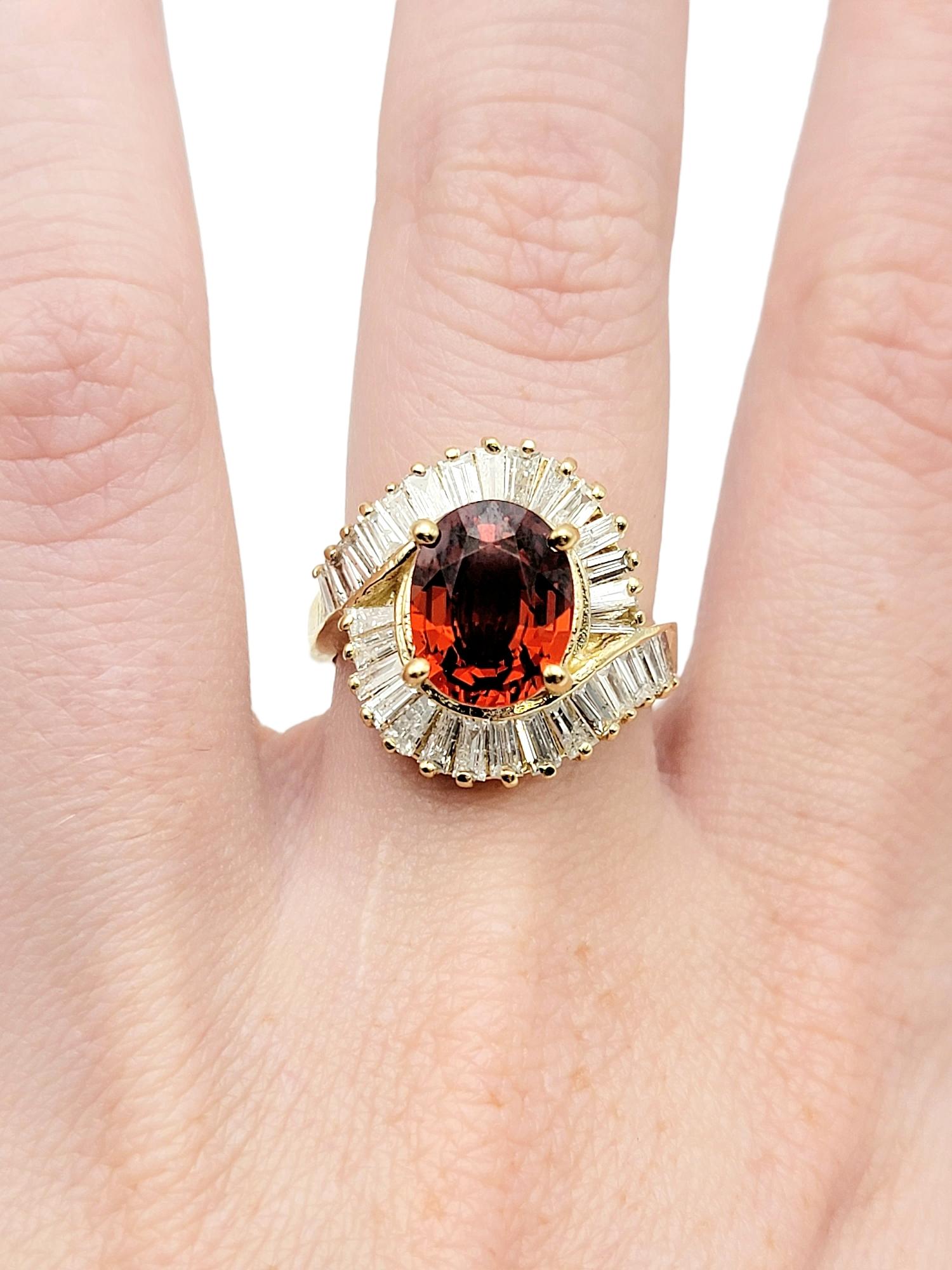 Oval Cut Garnet and Baguette Diamond Swirl Halo Cocktail Ring in 14 Karat Gold For Sale 8