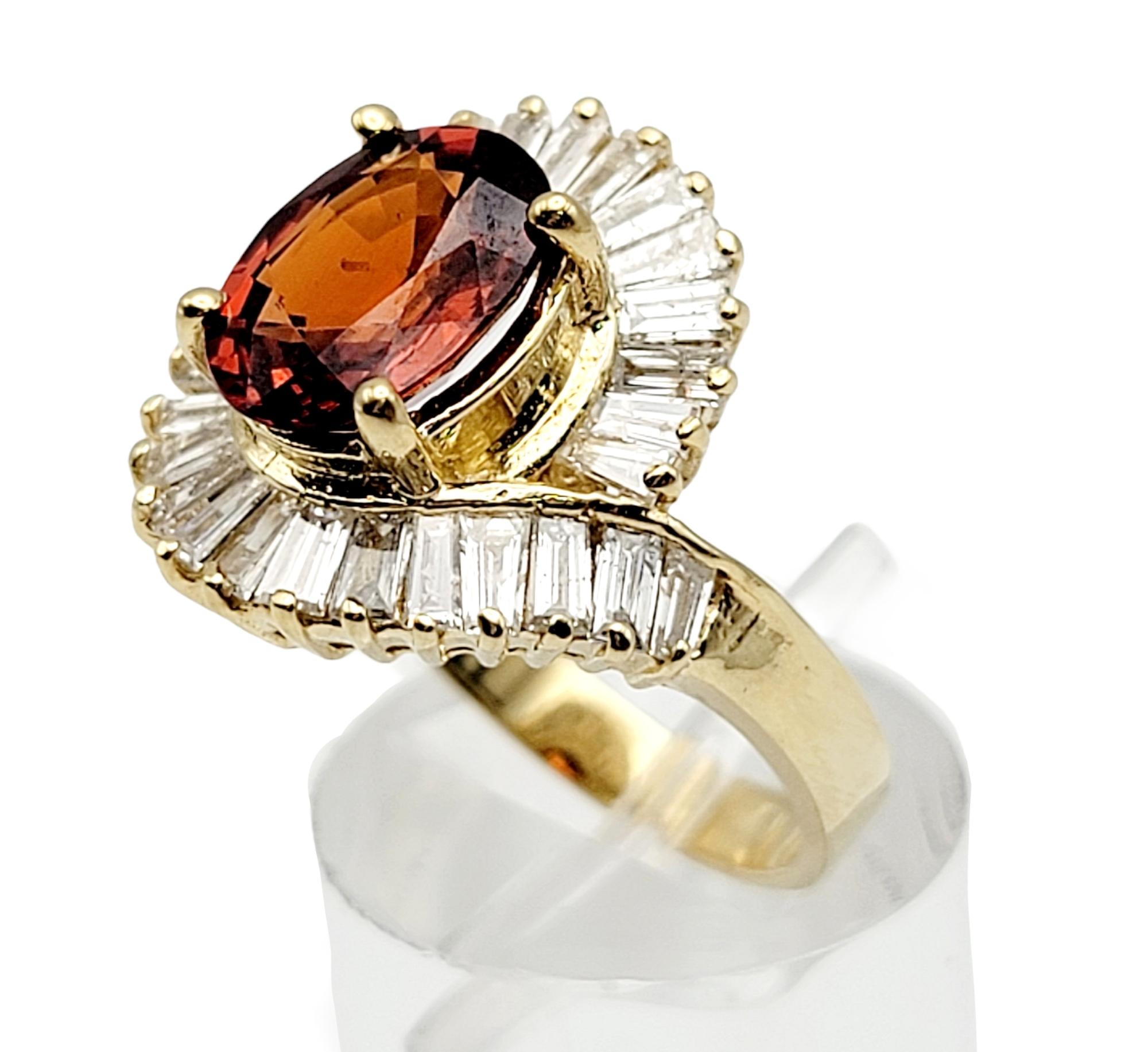 Oval Cut Garnet and Baguette Diamond Swirl Halo Cocktail Ring in 14 Karat Gold For Sale 2