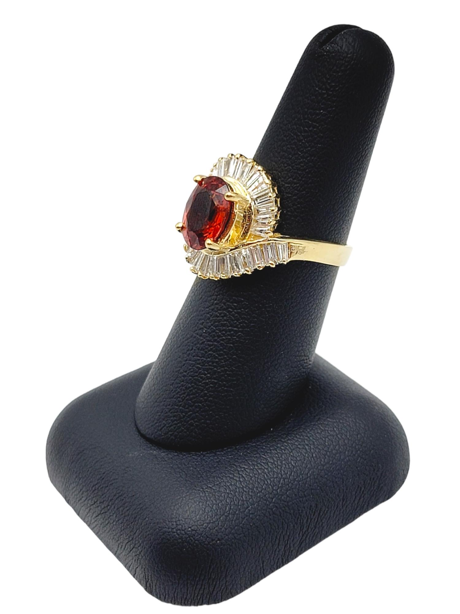 Oval Cut Garnet and Baguette Diamond Swirl Halo Cocktail Ring in 14 Karat Gold For Sale 4